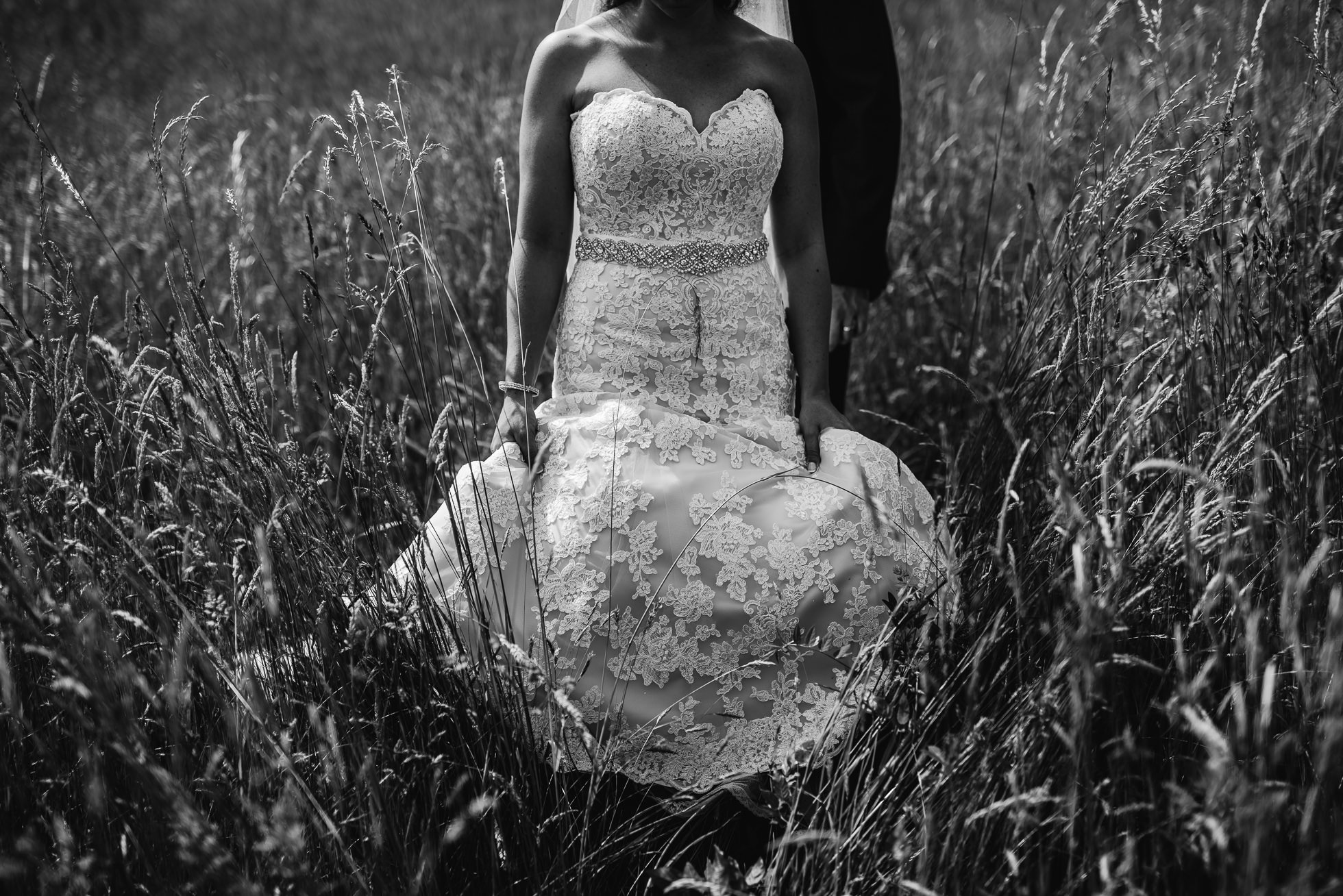 bride holding dress