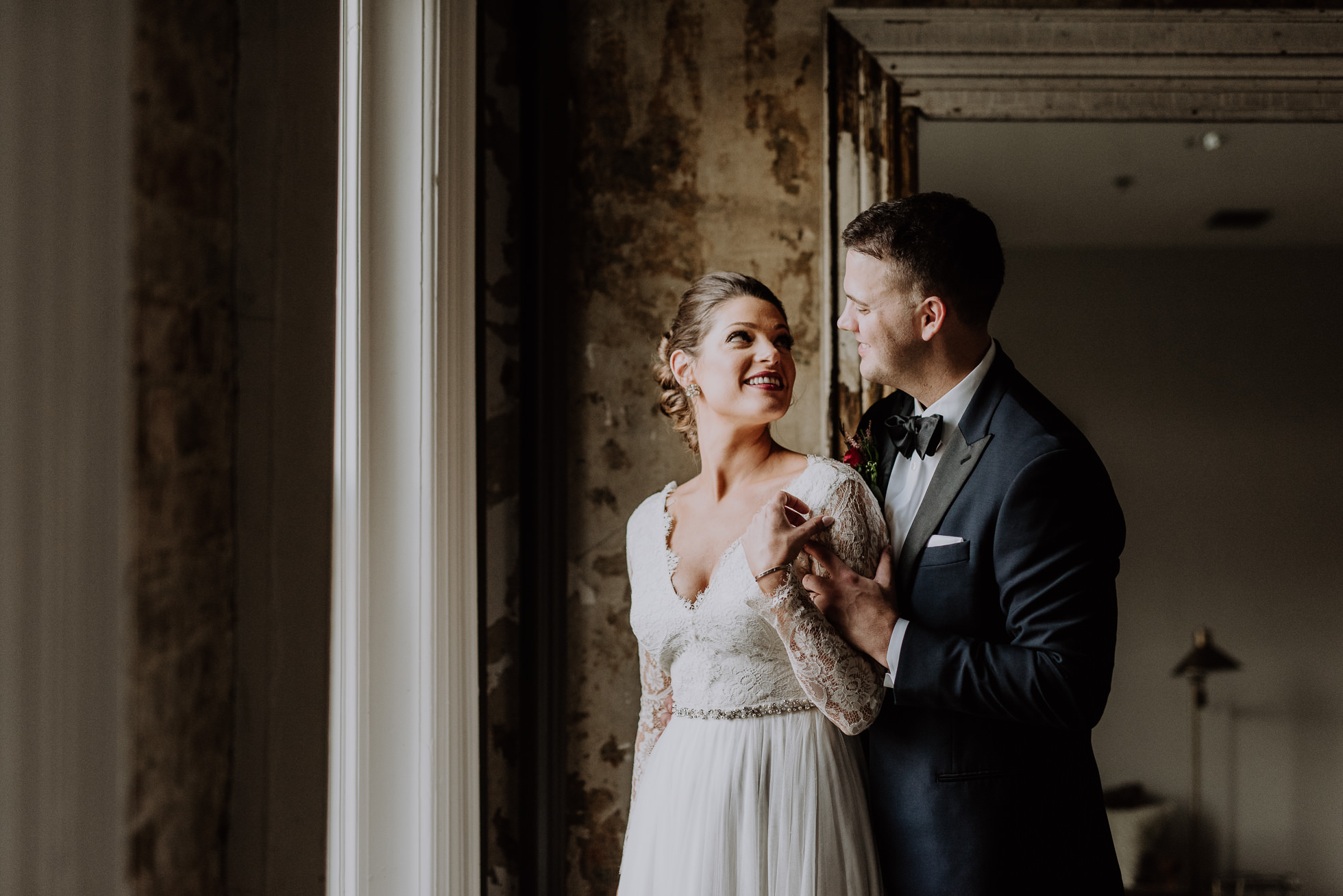 bride and groom by window at the cordelle nashville