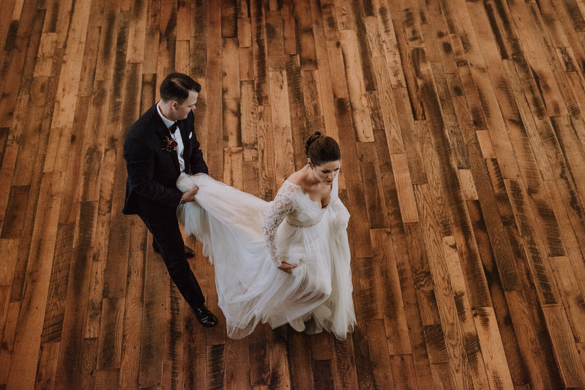 groom helping bride carry dress at the cordelle nashville