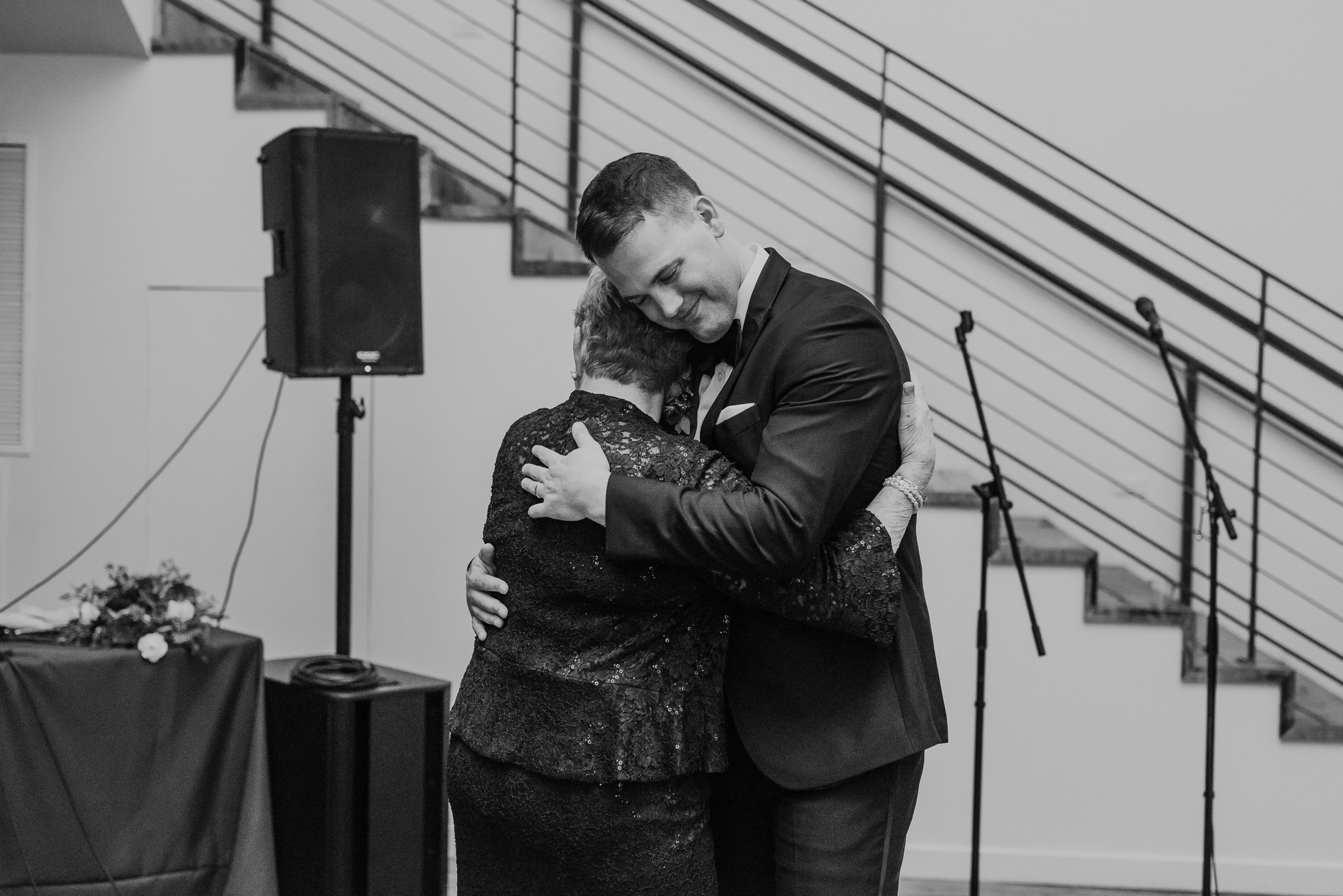 groom and grandmother hug at the cordelle wedding reception