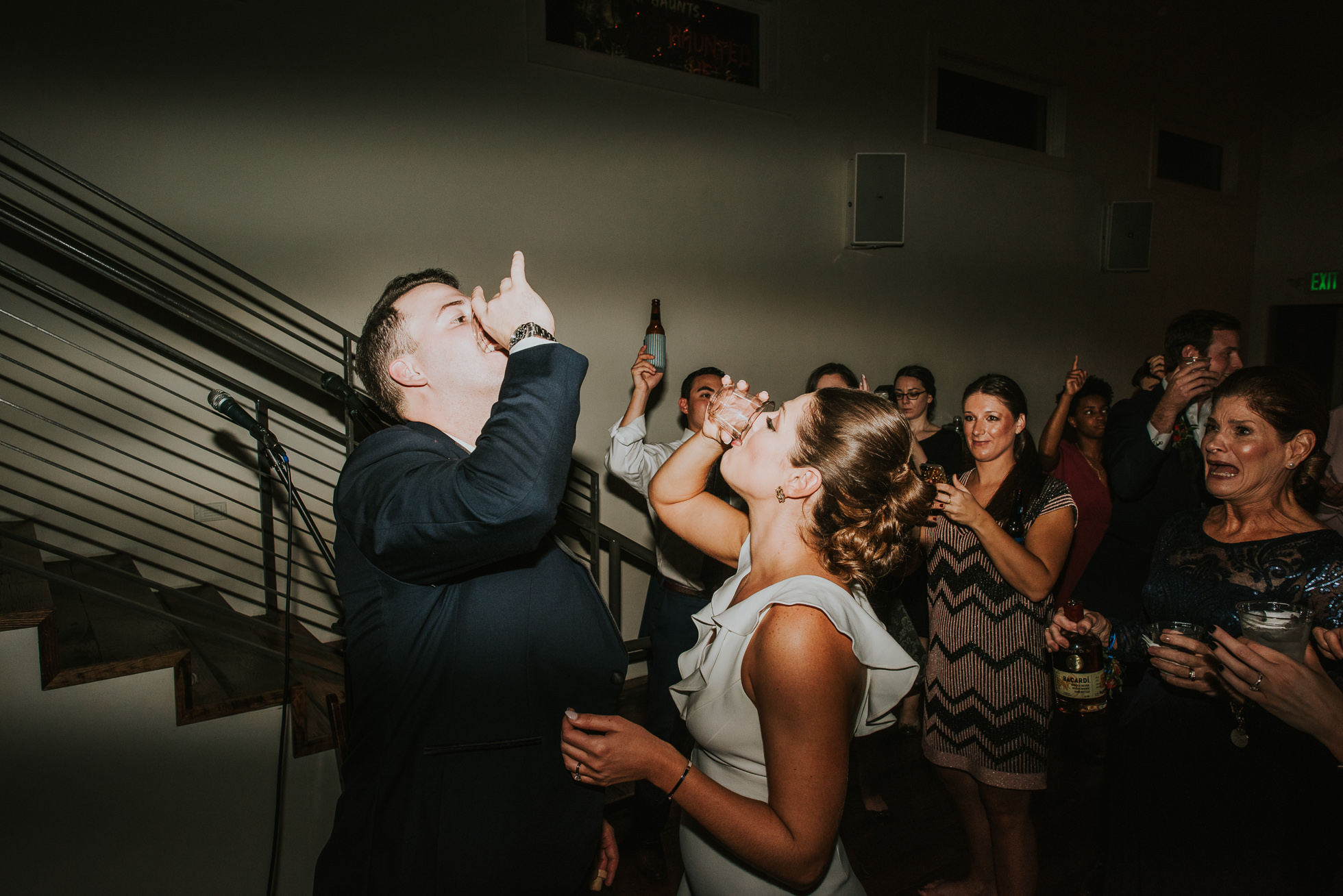 bride and groom drinking shots at wedding reception at the cordelle nashville wedding