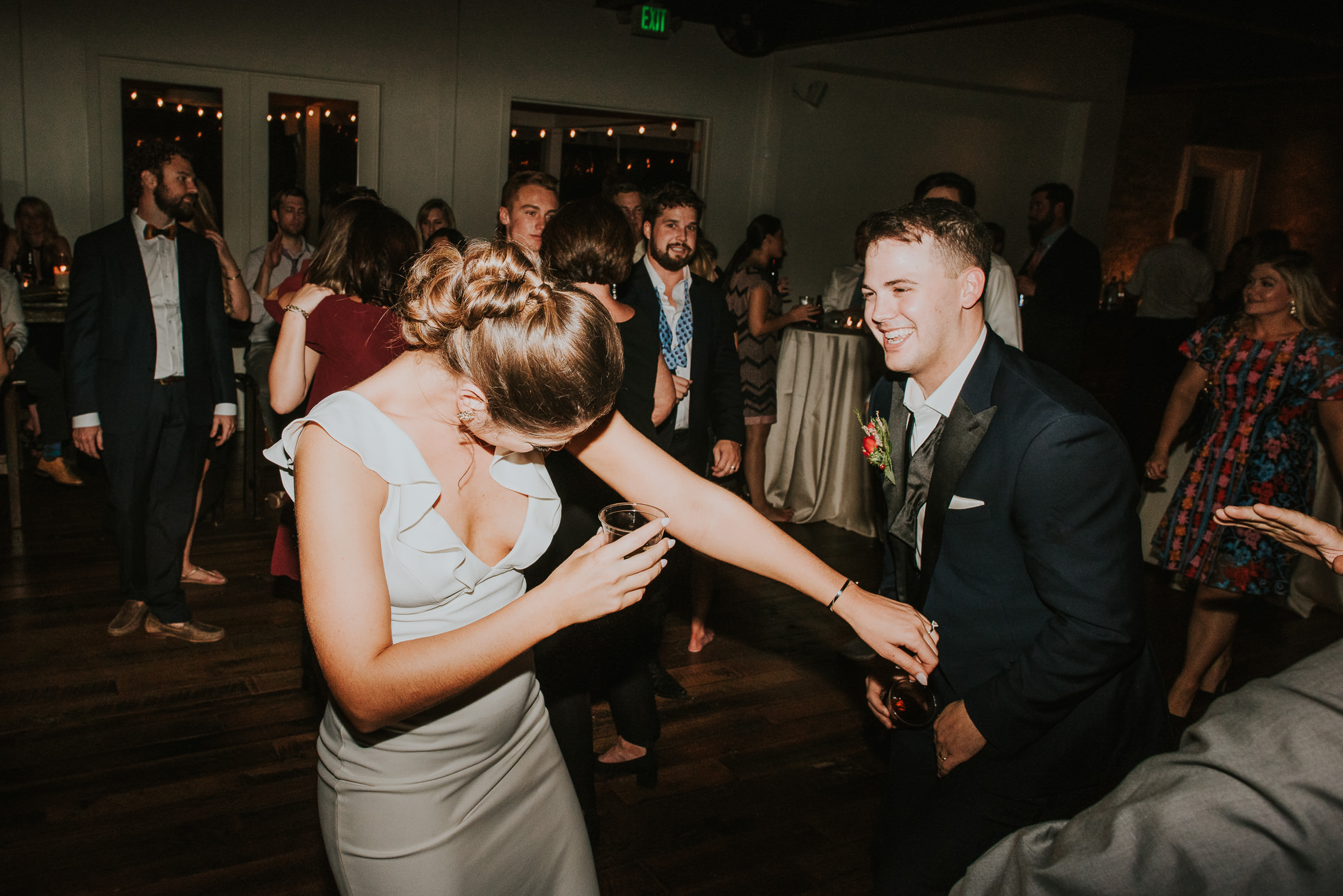 rowdy bride and groom at wedding reception the cordelle