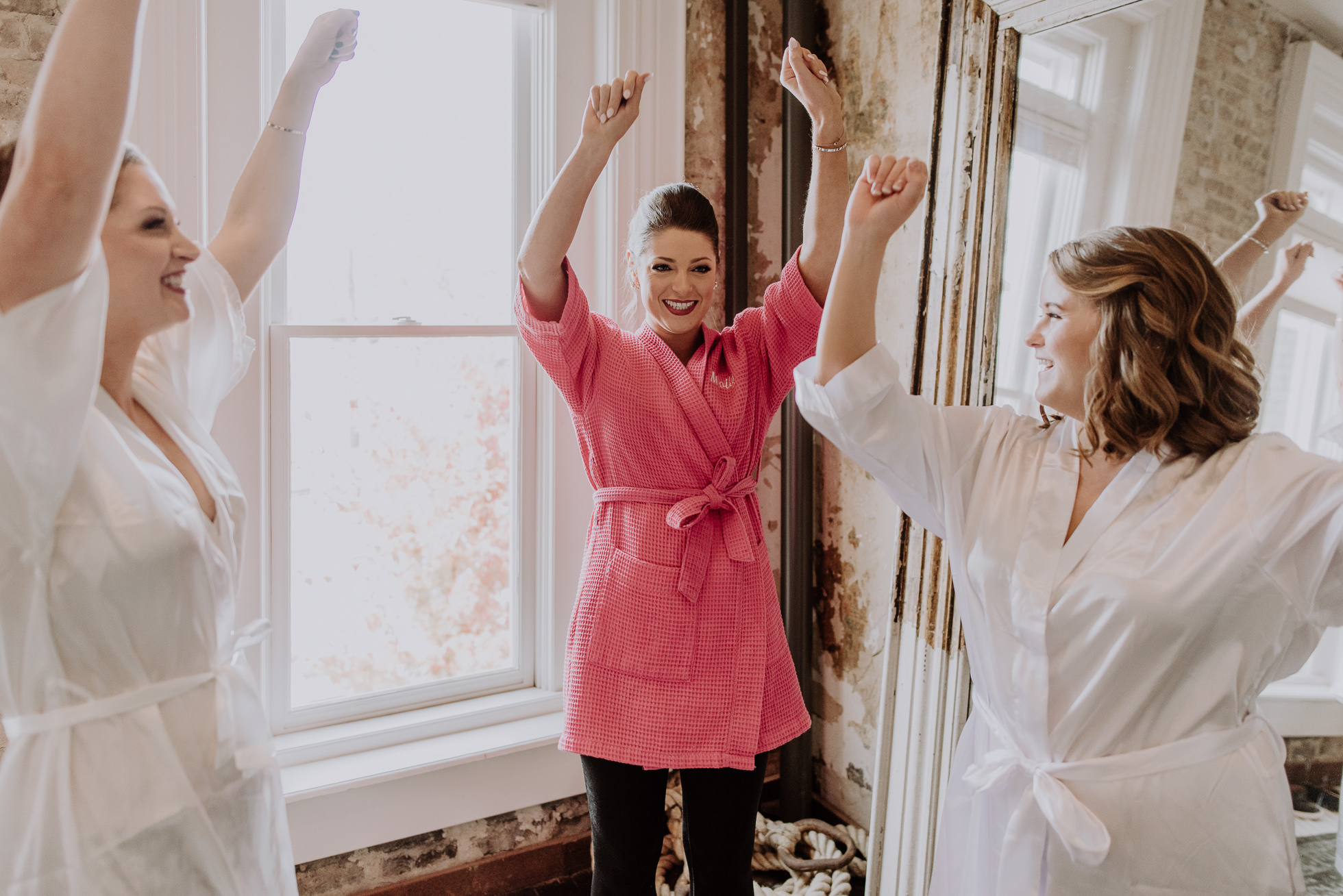 bride and maids of honor cheerleading the cordelle