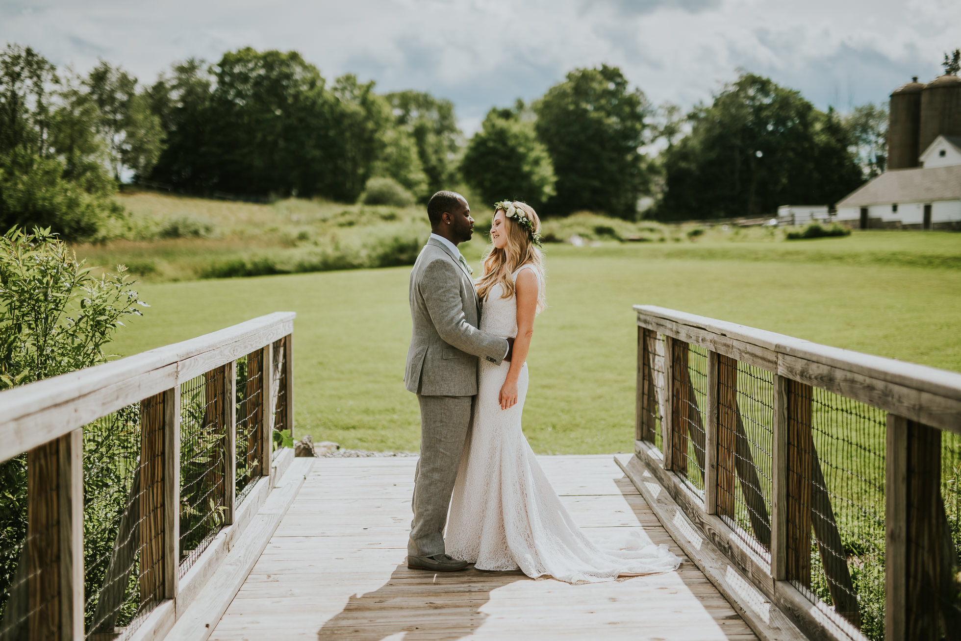 bride and groom on a bridge photographed by Traverse the Tides