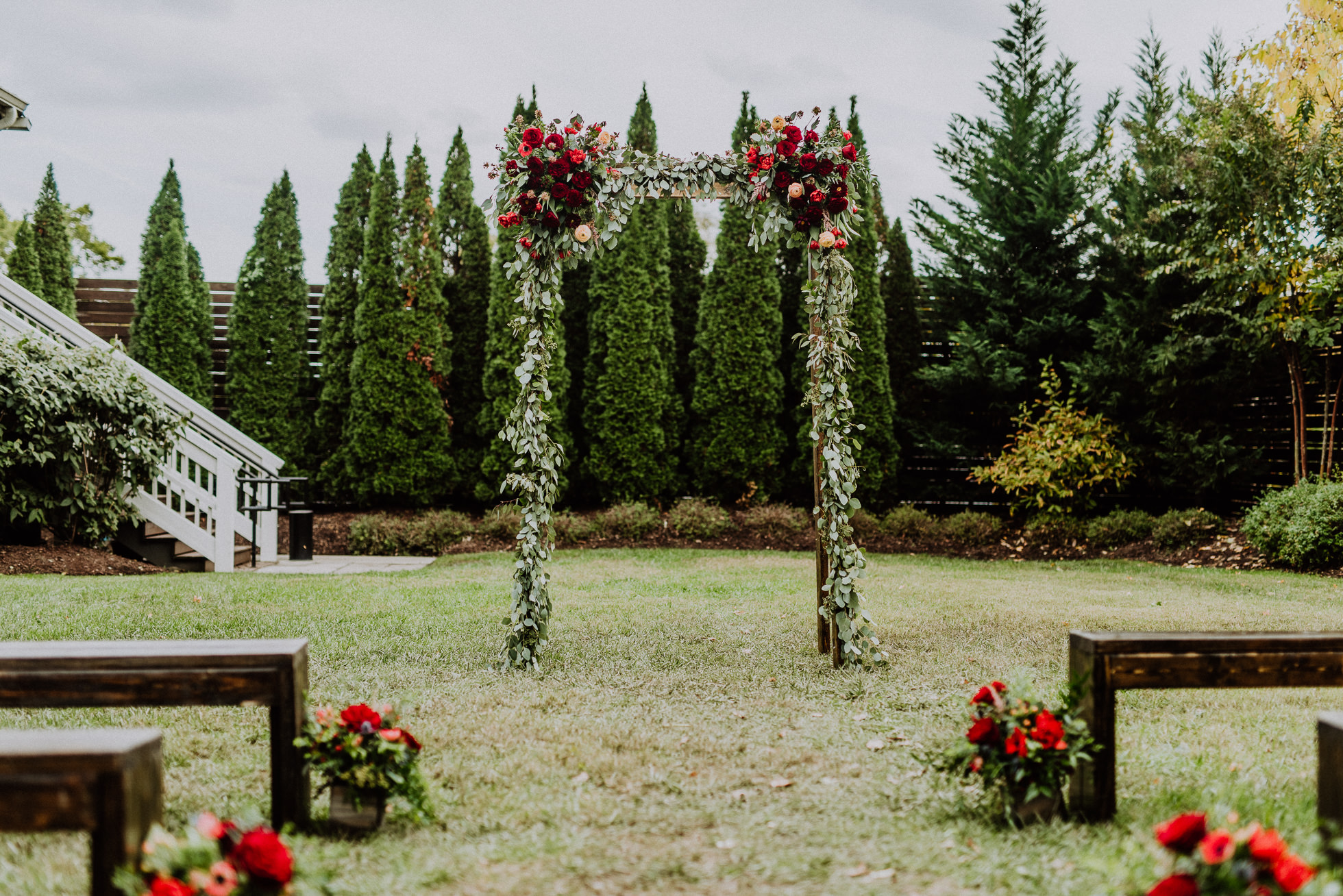 red floral wedding arch nashville