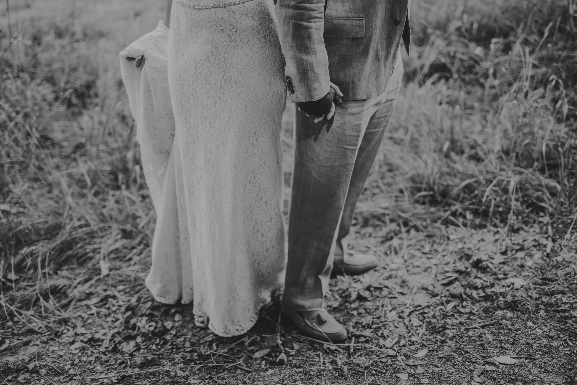 bride and groom holding hands photographed by Traverse the Tides