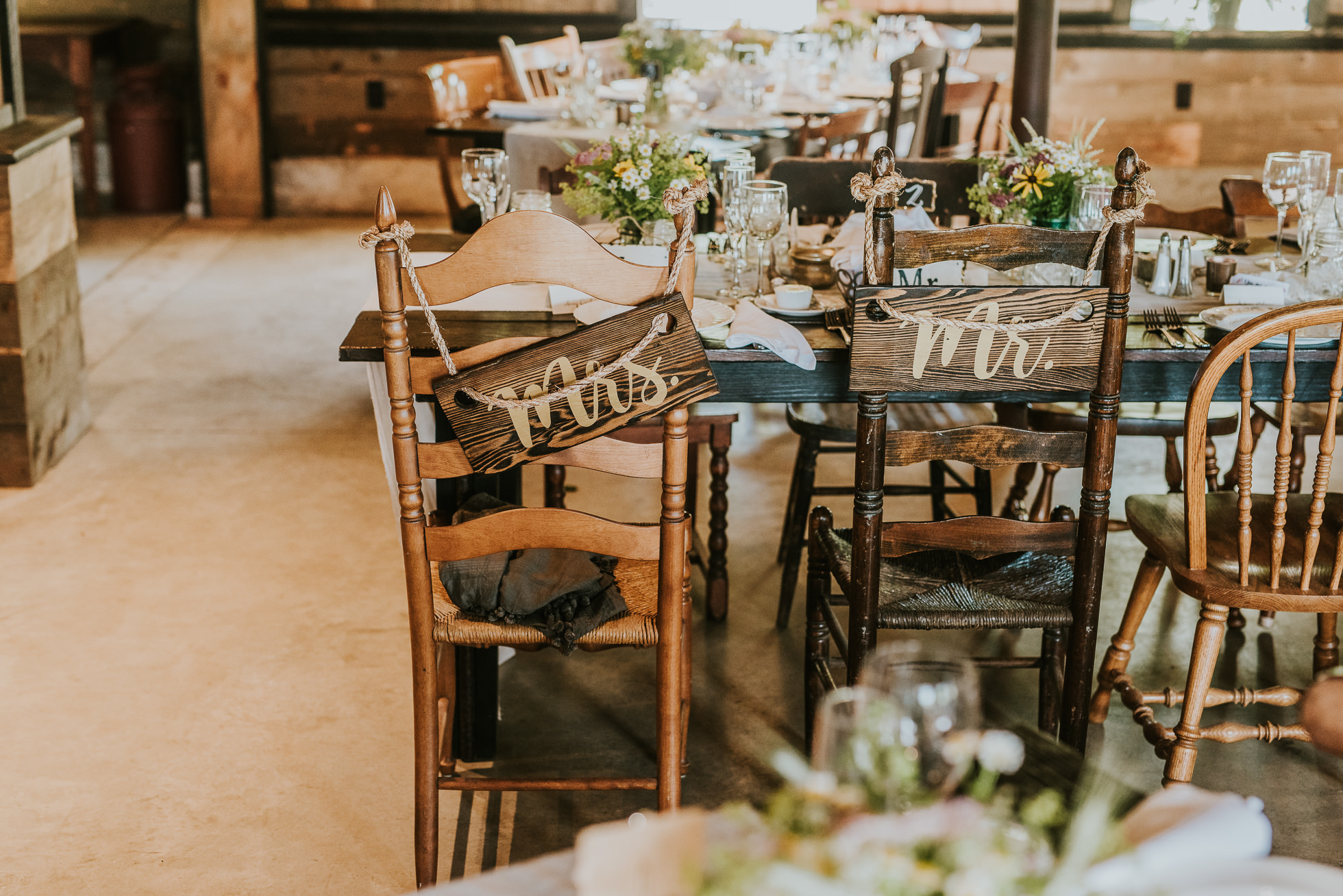 Mr & Mrs rustic wedding signs photographed by Traverse the Tides