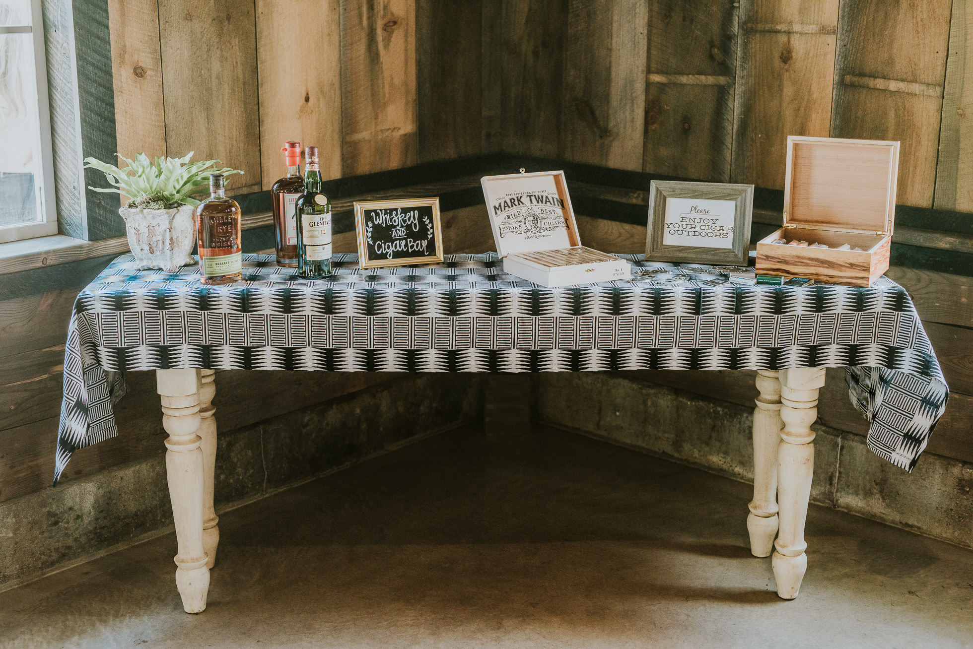 rustic cigar and whiskey table wedding photographed by Traverse the Tides