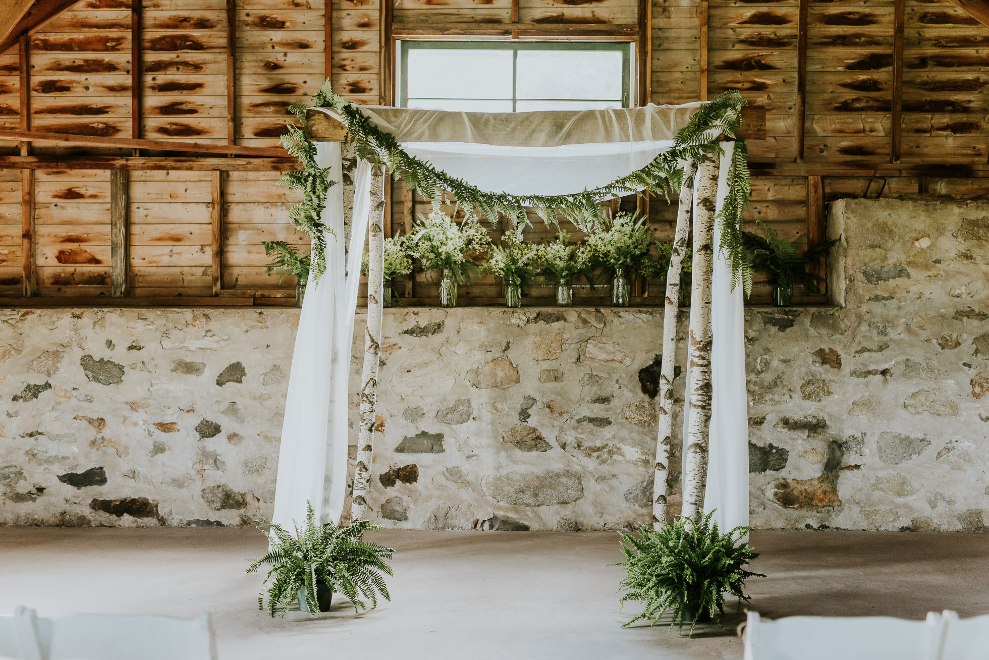 wedding ceremony ferns photographed by Traverse the Tides