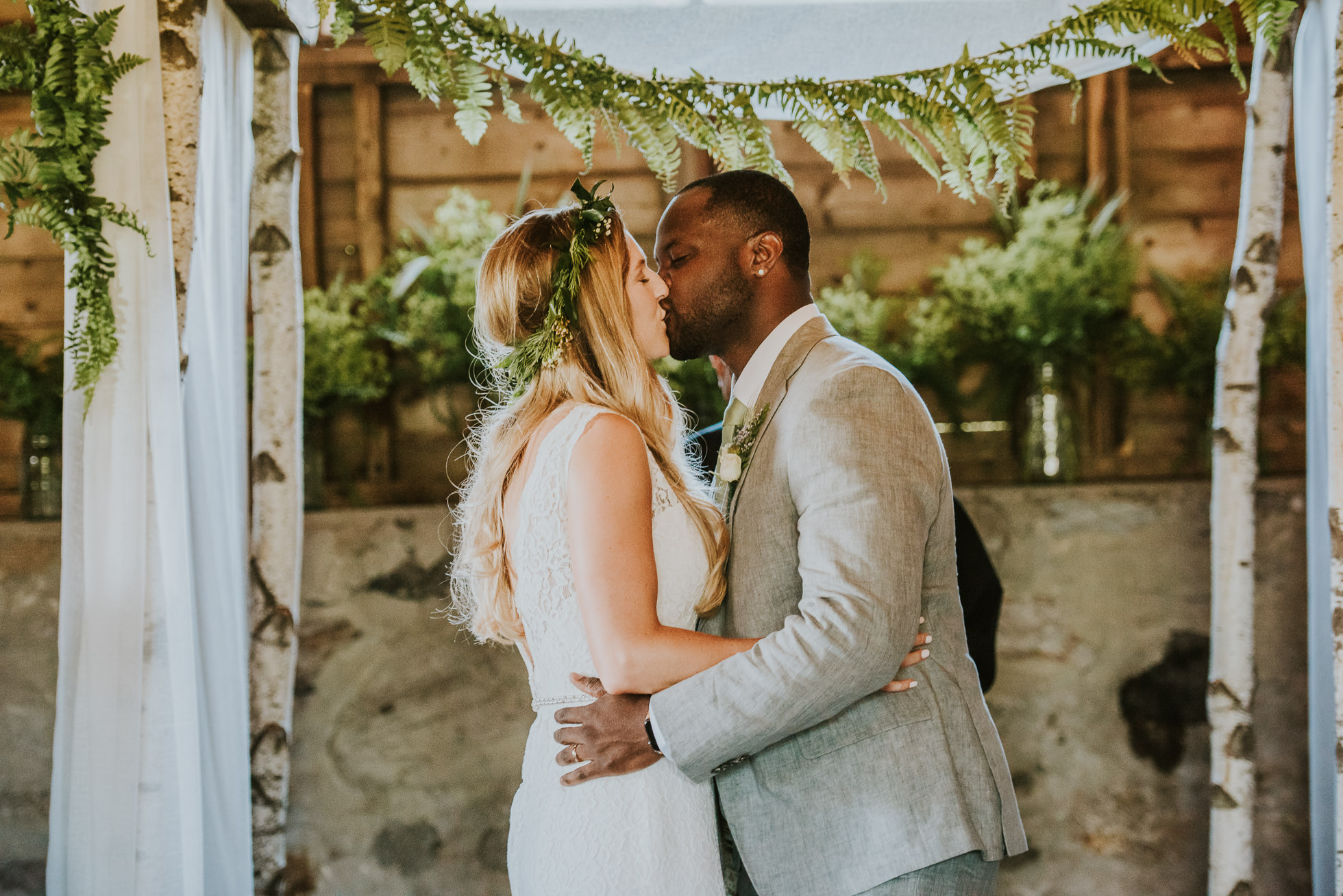 farm wedding first kiss photographed by Traverse the Tides