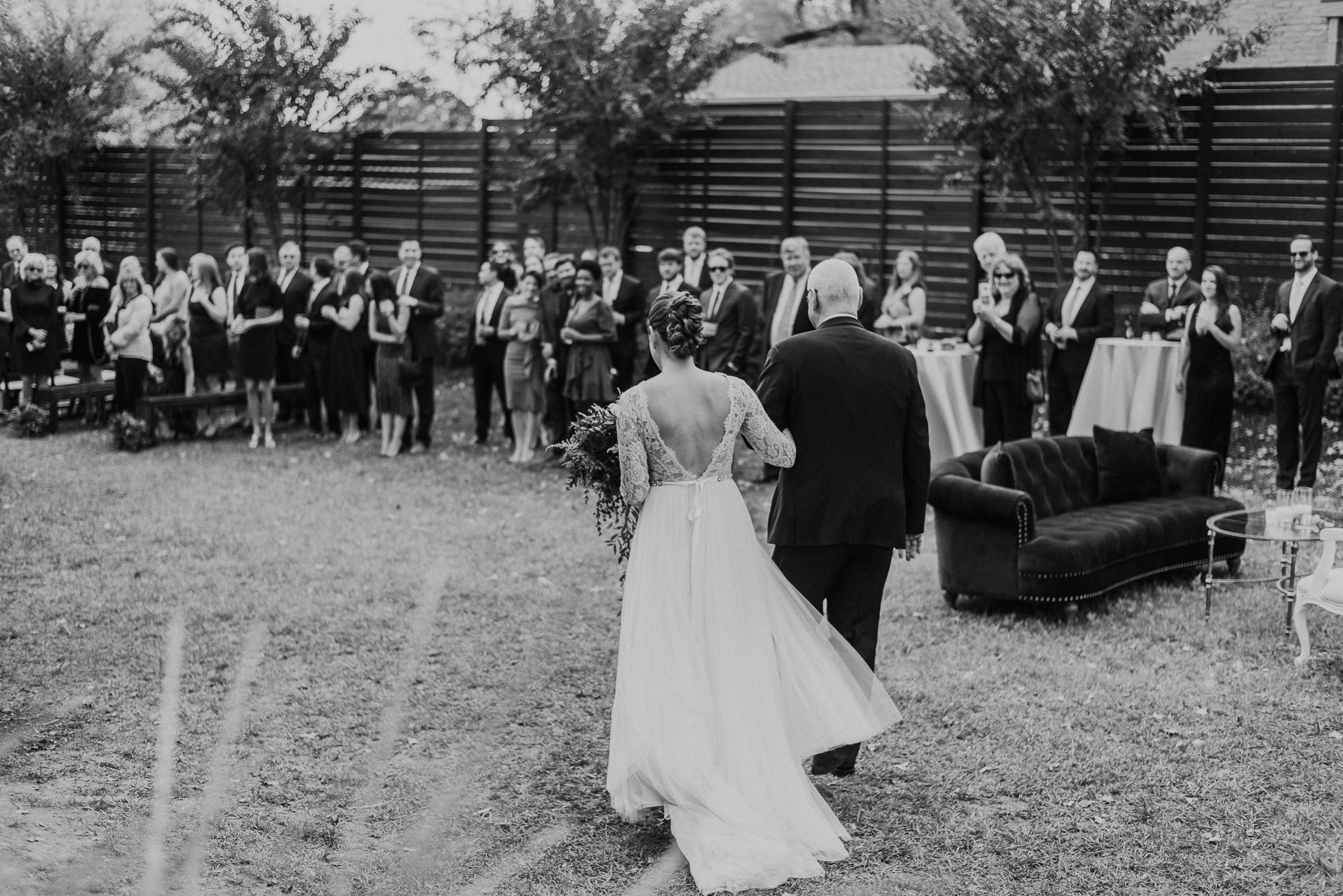 bride and father entering outdoor wedding ceremony at the cordelle nashville