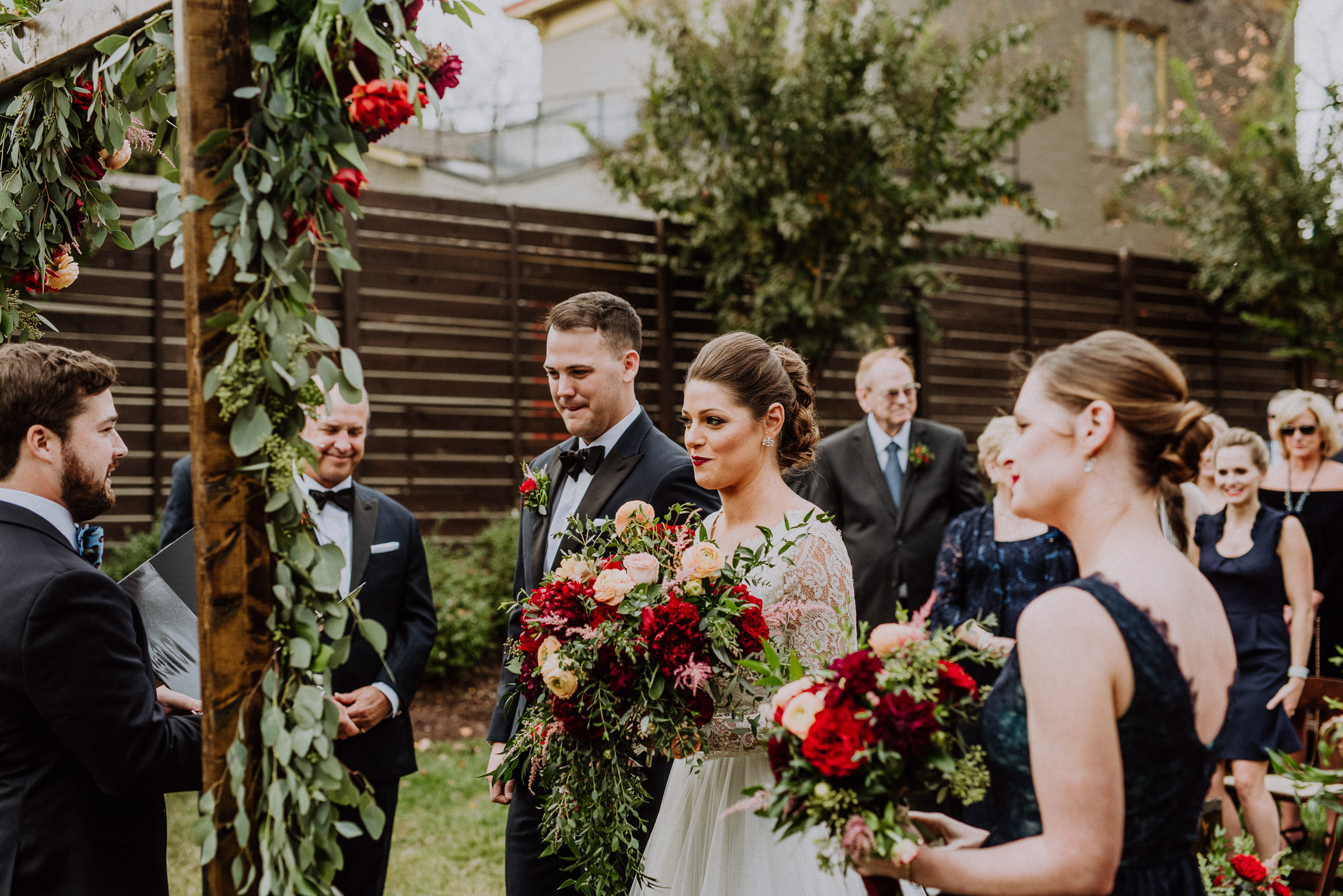 bride and groom at the alter the cordelle nashville wedding