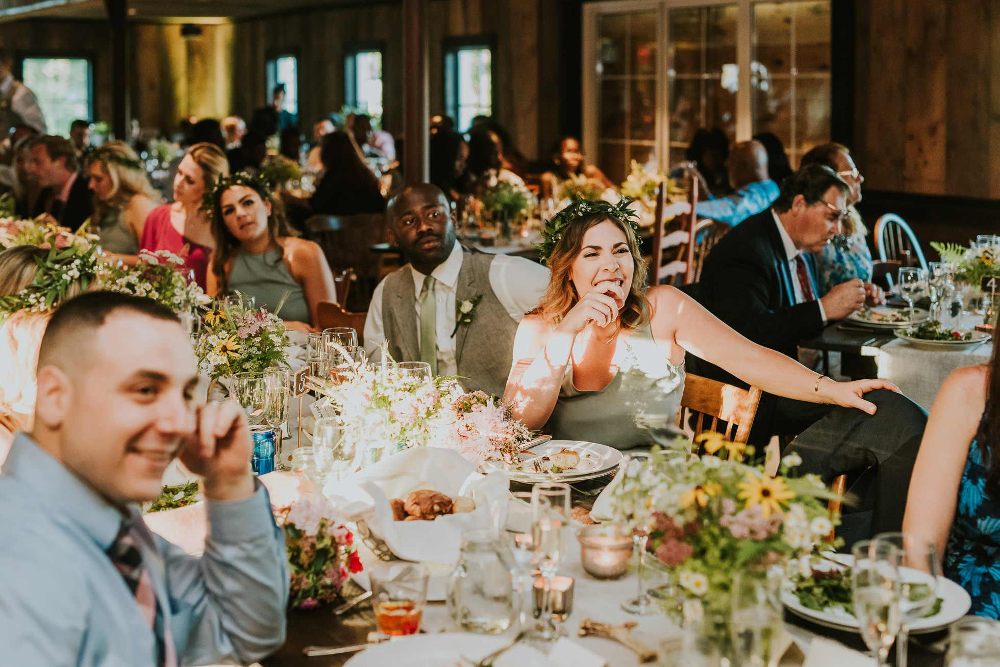 rustic wedding table with guests photographed by Traverse the Tides