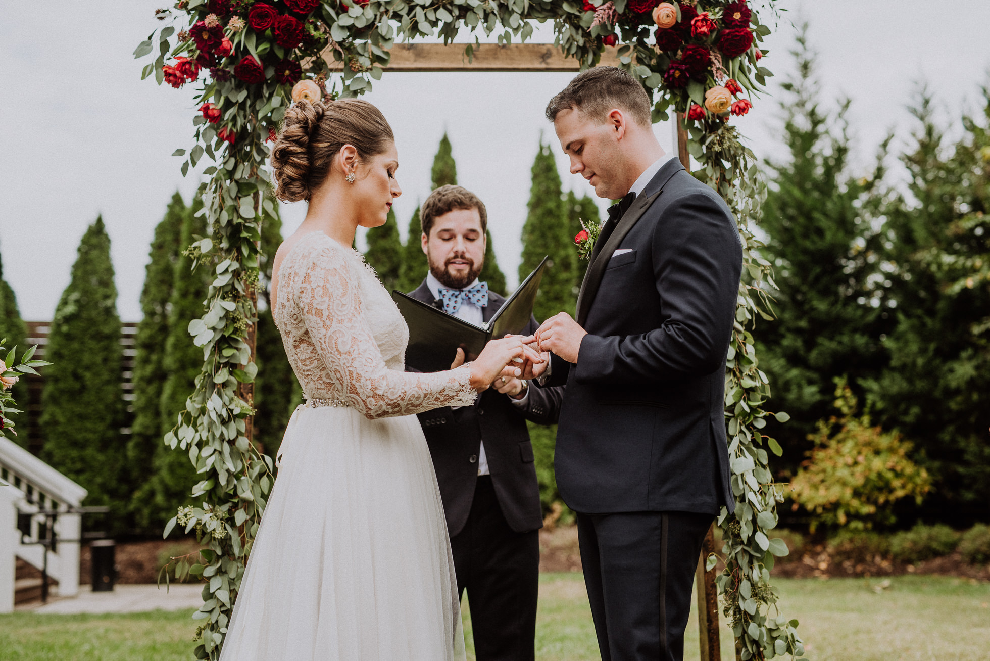 bride and groom exchanging rings the cordelle nashville wedding