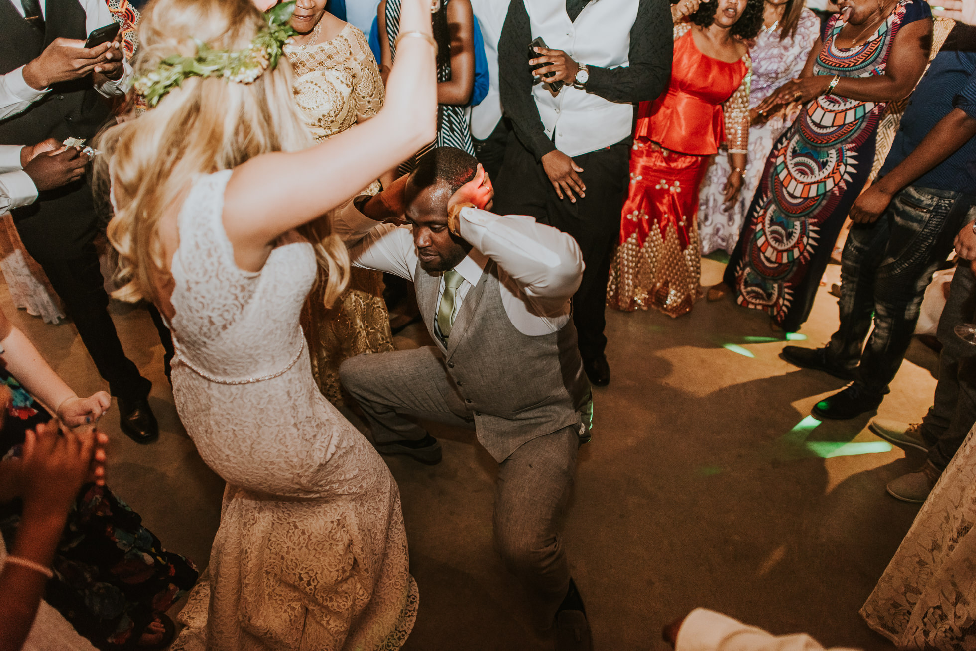 groom dancing with bride photographed by Traverse the Tides