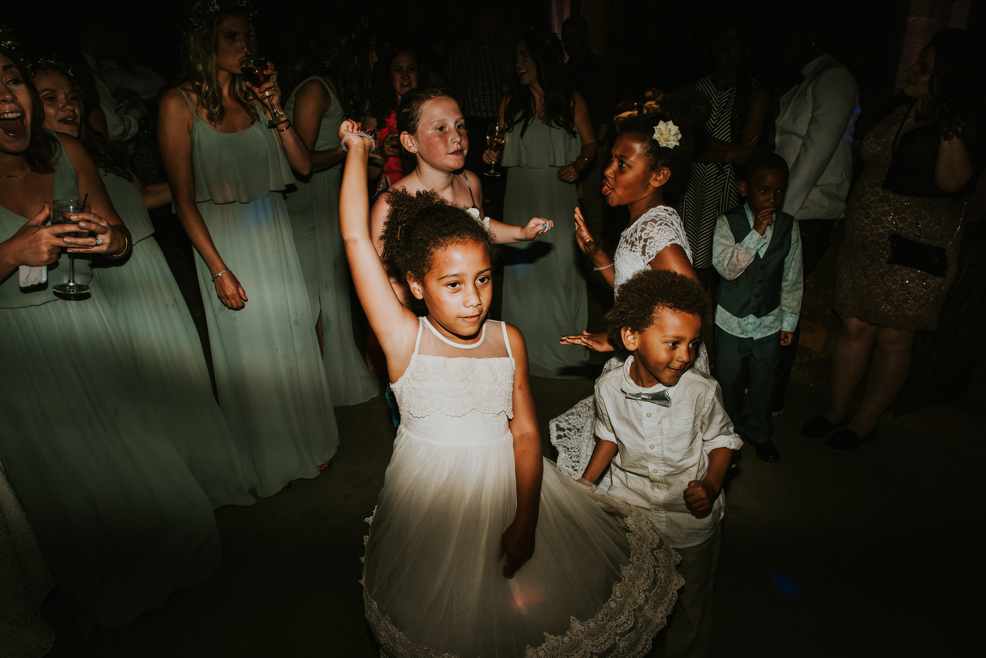 flower girl and ring bearer dancing photographed by Traverse the Tides