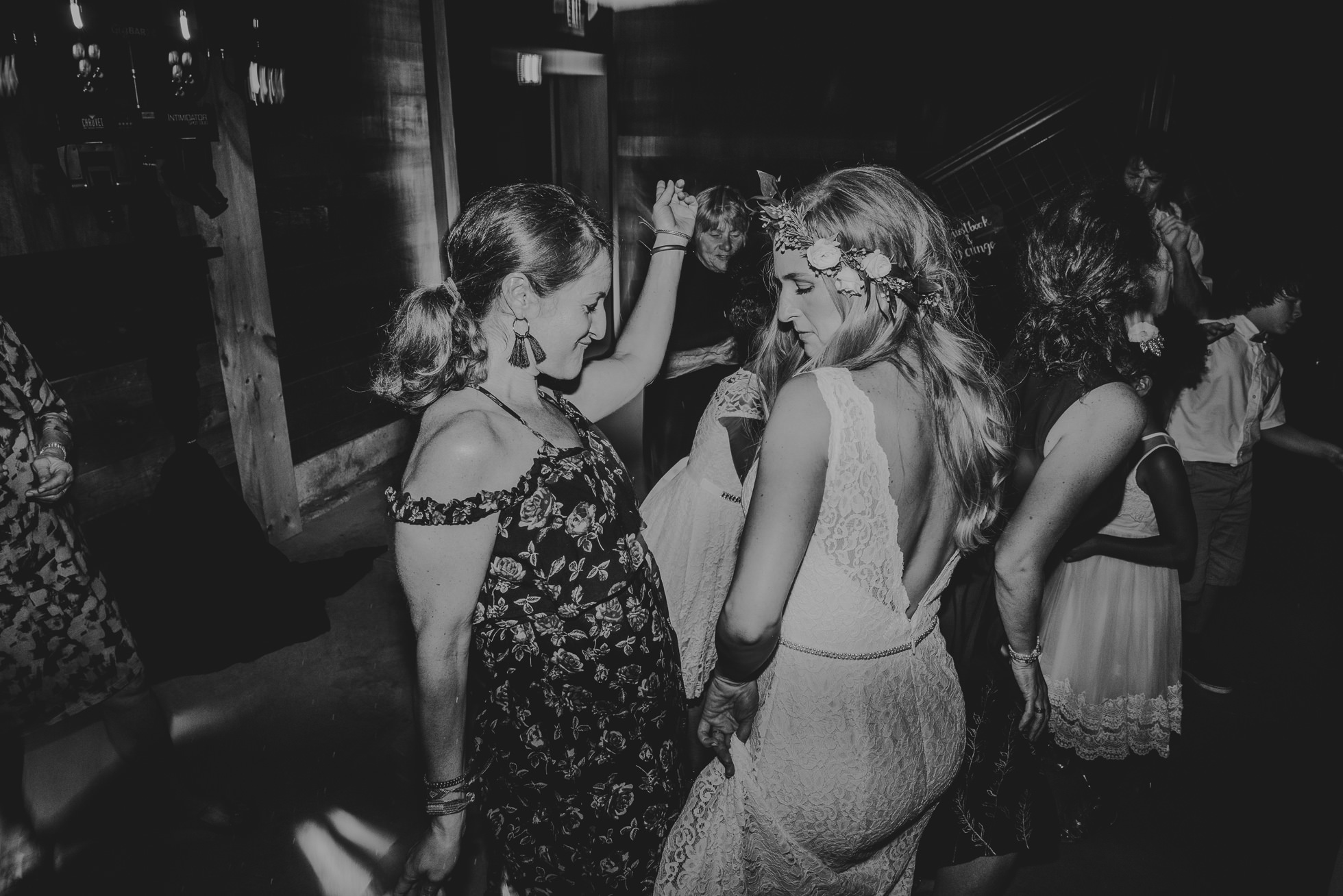 boho bride dancing with guests photographed by Traverse the Tides