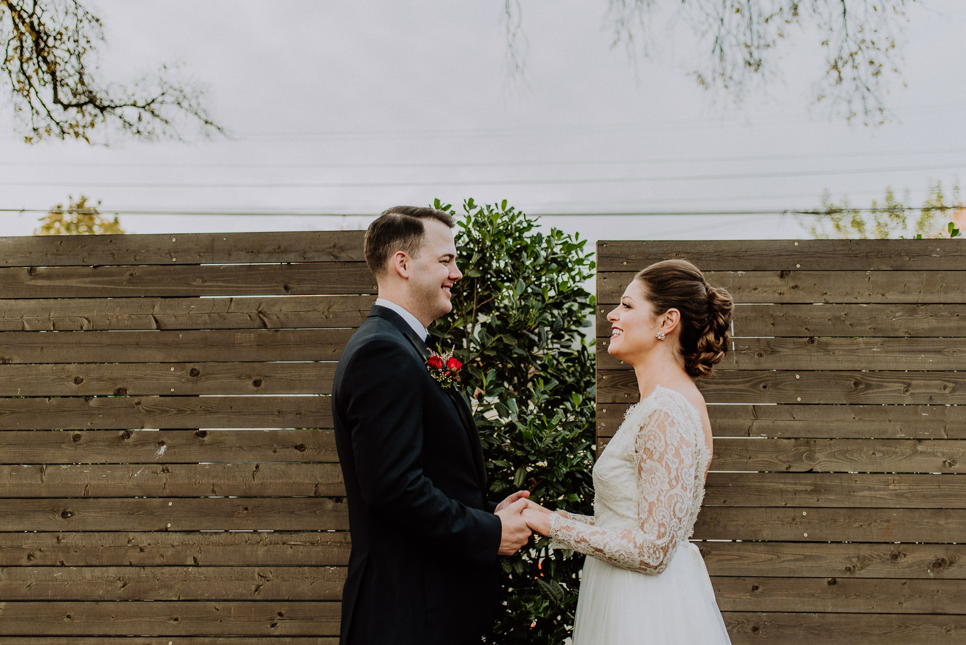 bride and groom hold hands outside of the cordelle nashville