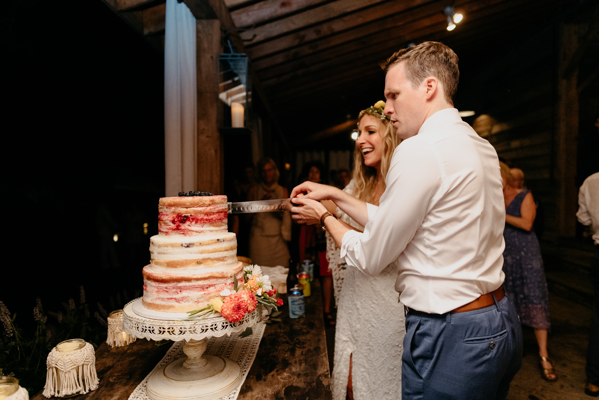 bride and groom cut the cake