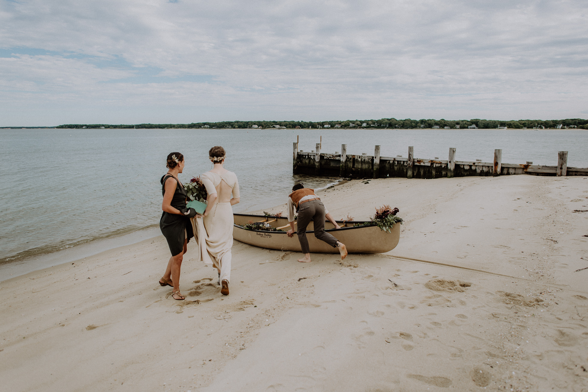 bride and groom exiting ceremony in boat