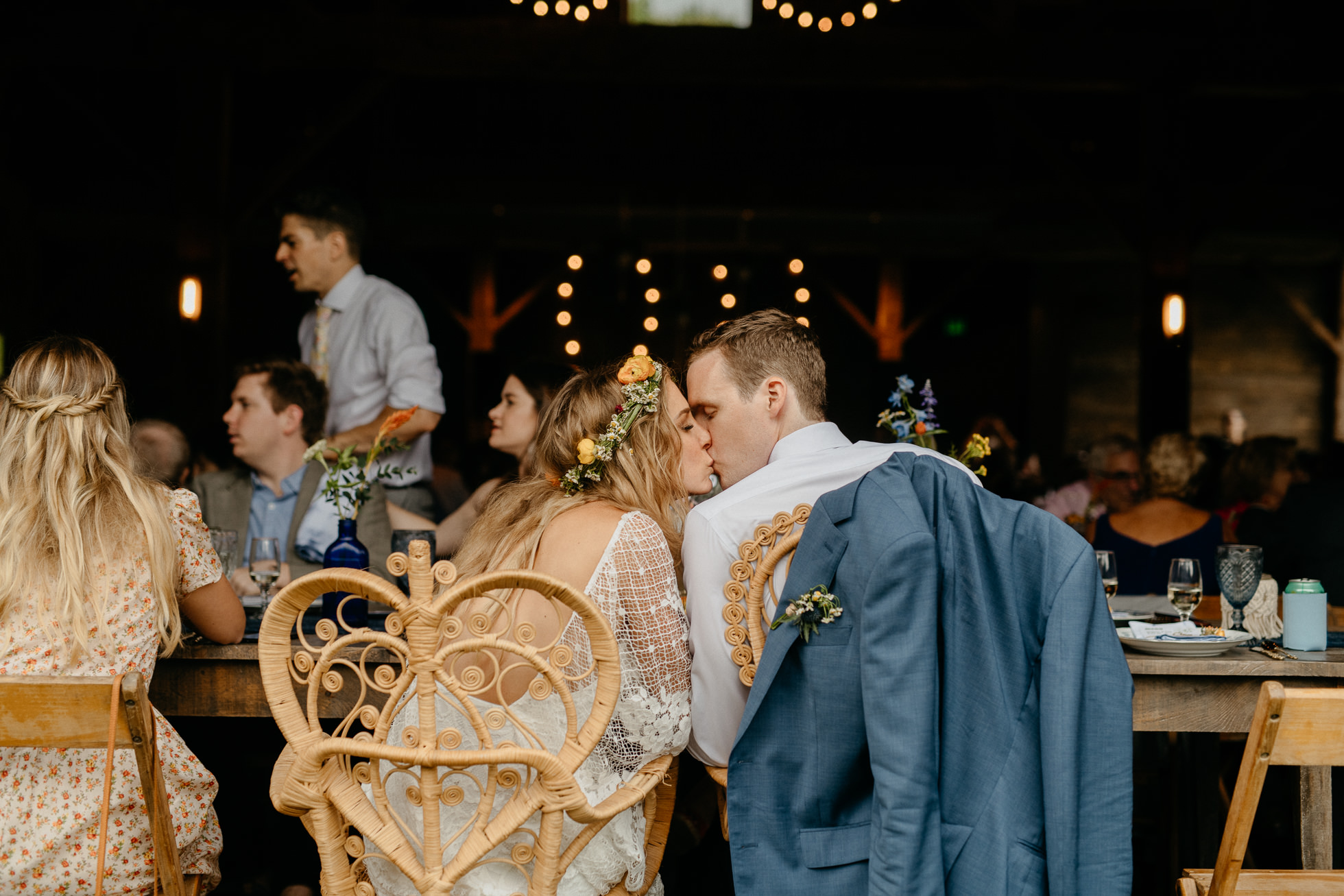 bride and groom kissing at reception