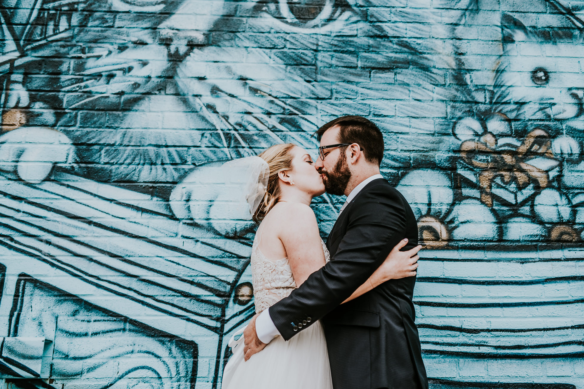 bride and groom kissing photographed by Traverse The Tides