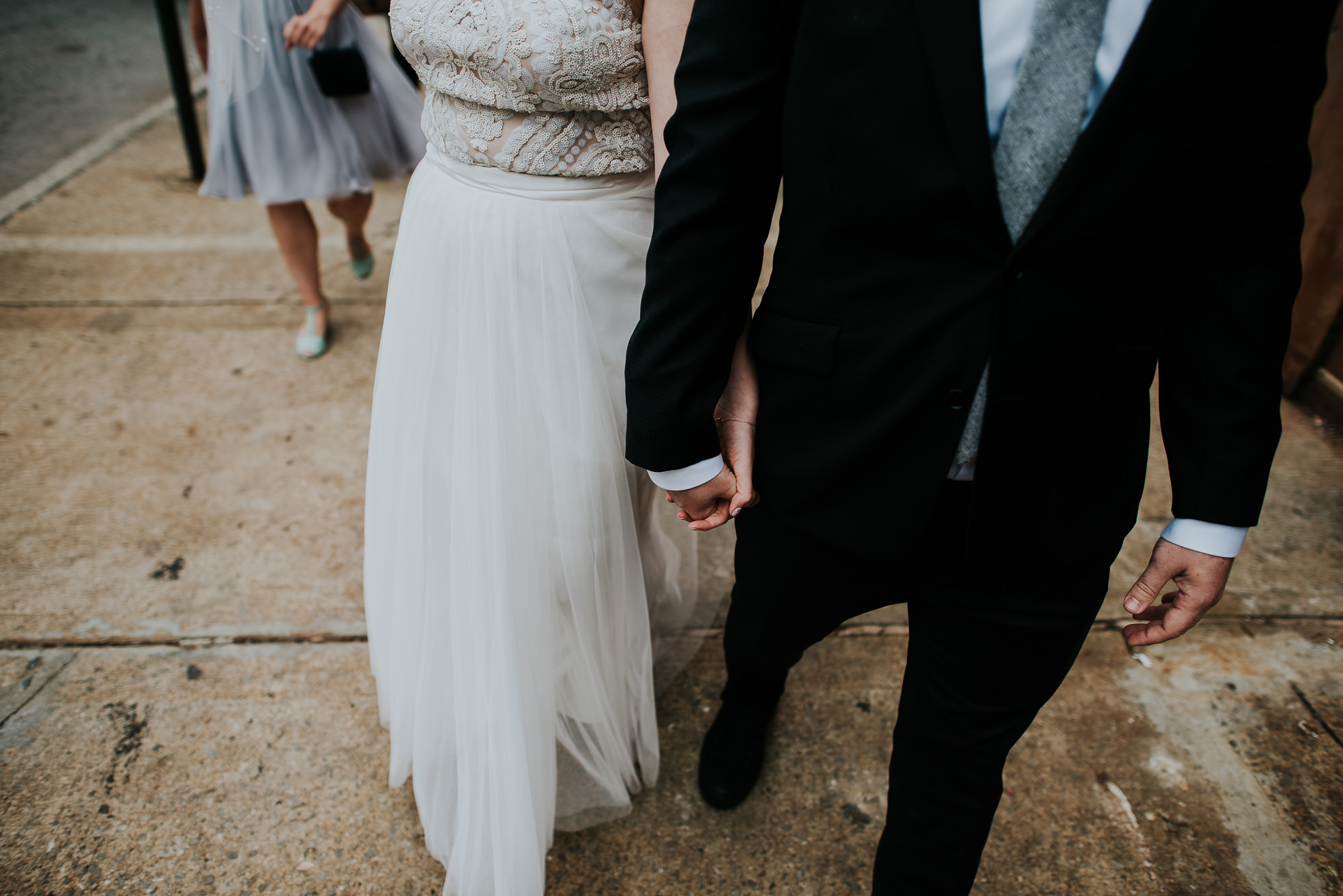 bride and groom walking photographed by Traverse The Tides