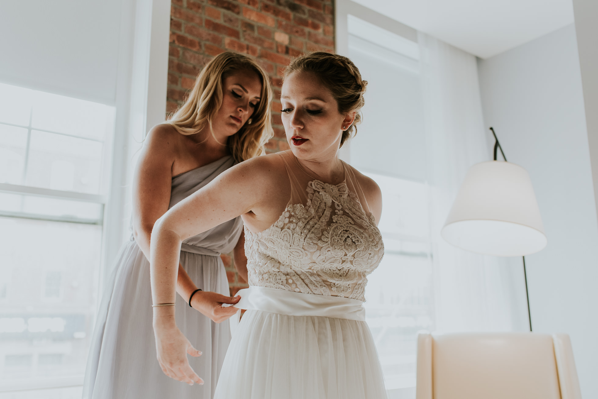 bride and maid of honor photographed by Traverse The Tides
