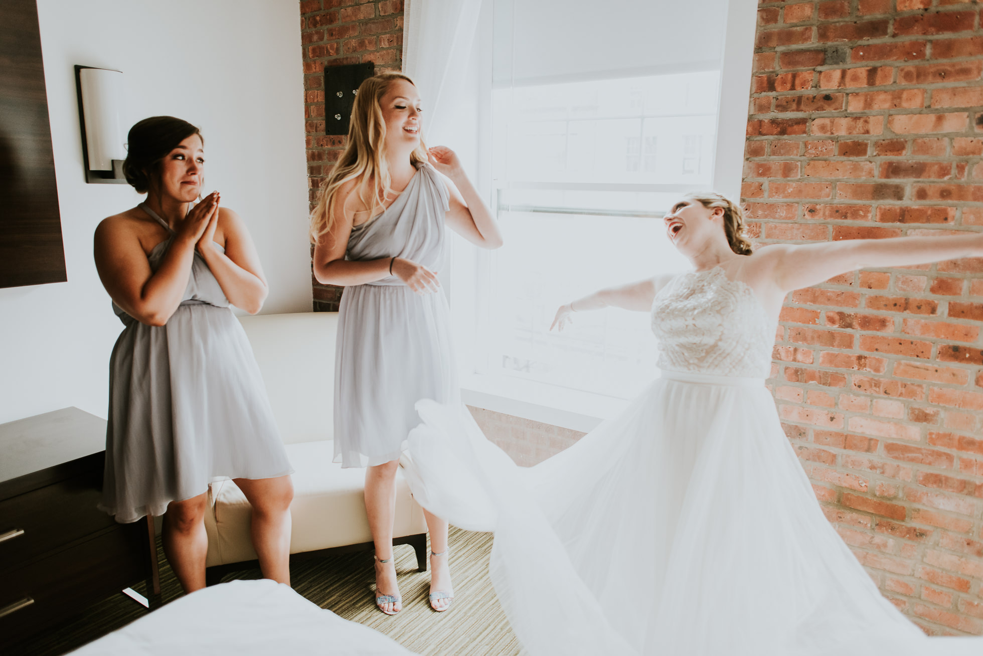 bride getting dressed photographed by Traverse The Tides