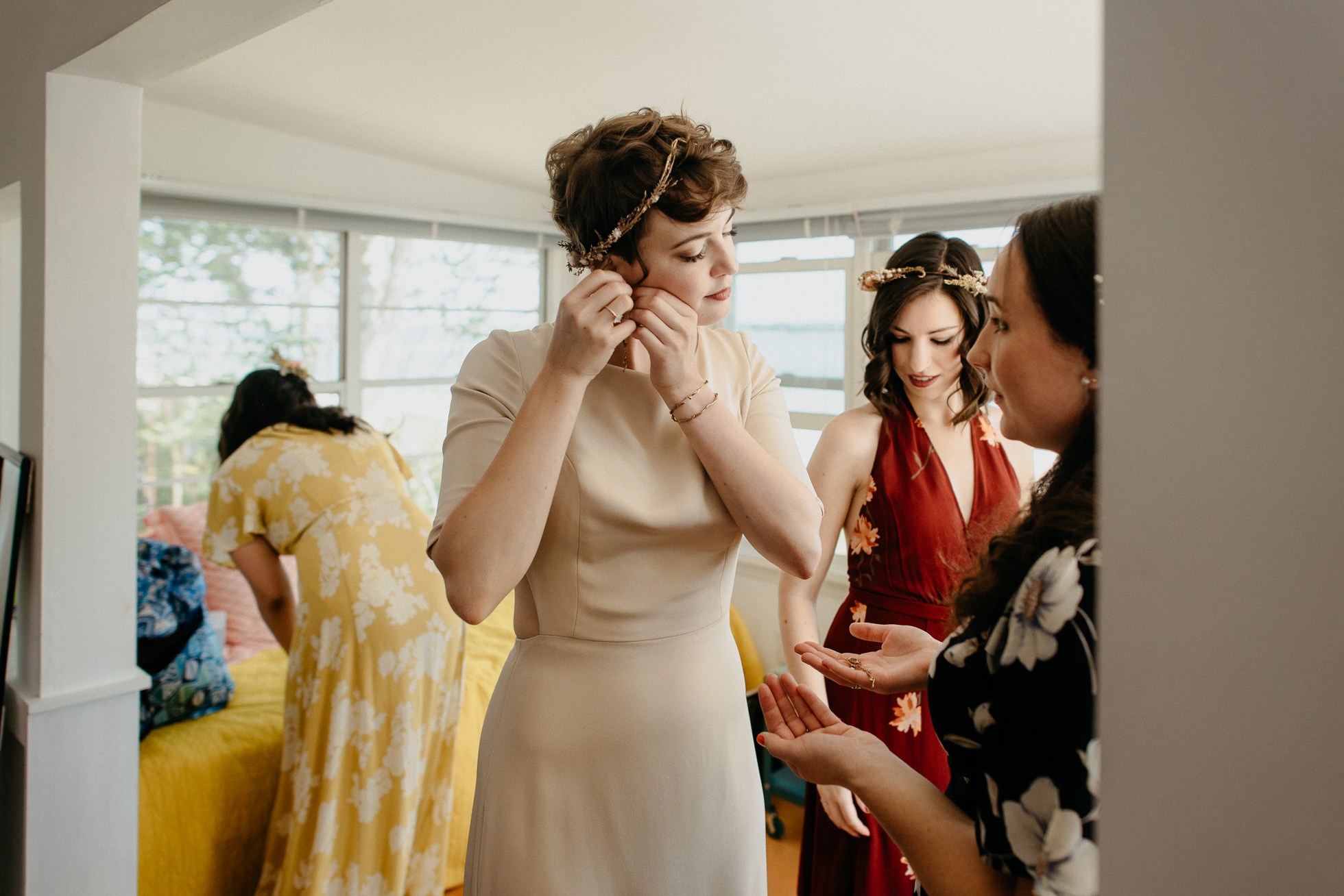 bride putting on earrings