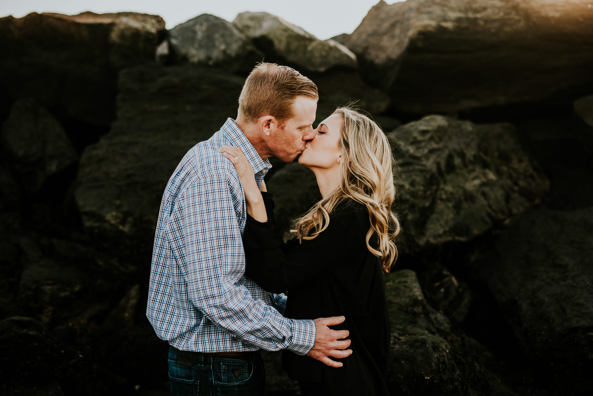 couple kissing engagement session photographed by Traverse the Tides