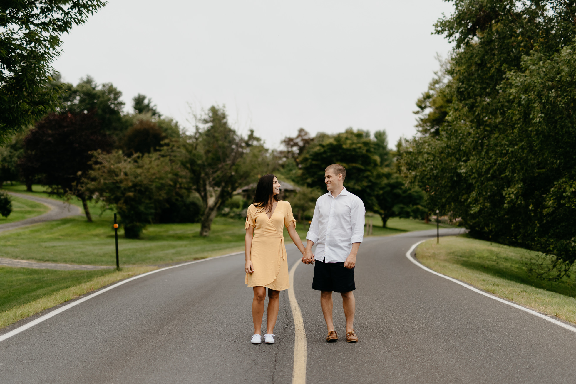 couple standing in the middle of the road
