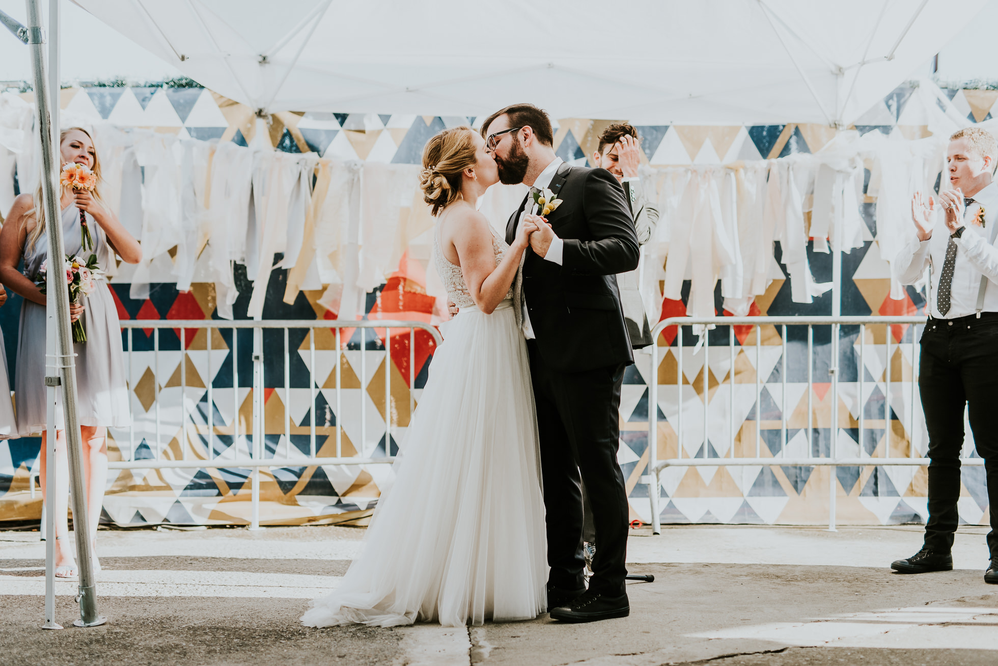 wedding first kiss as husband and wife photographed by Traverse The Tides