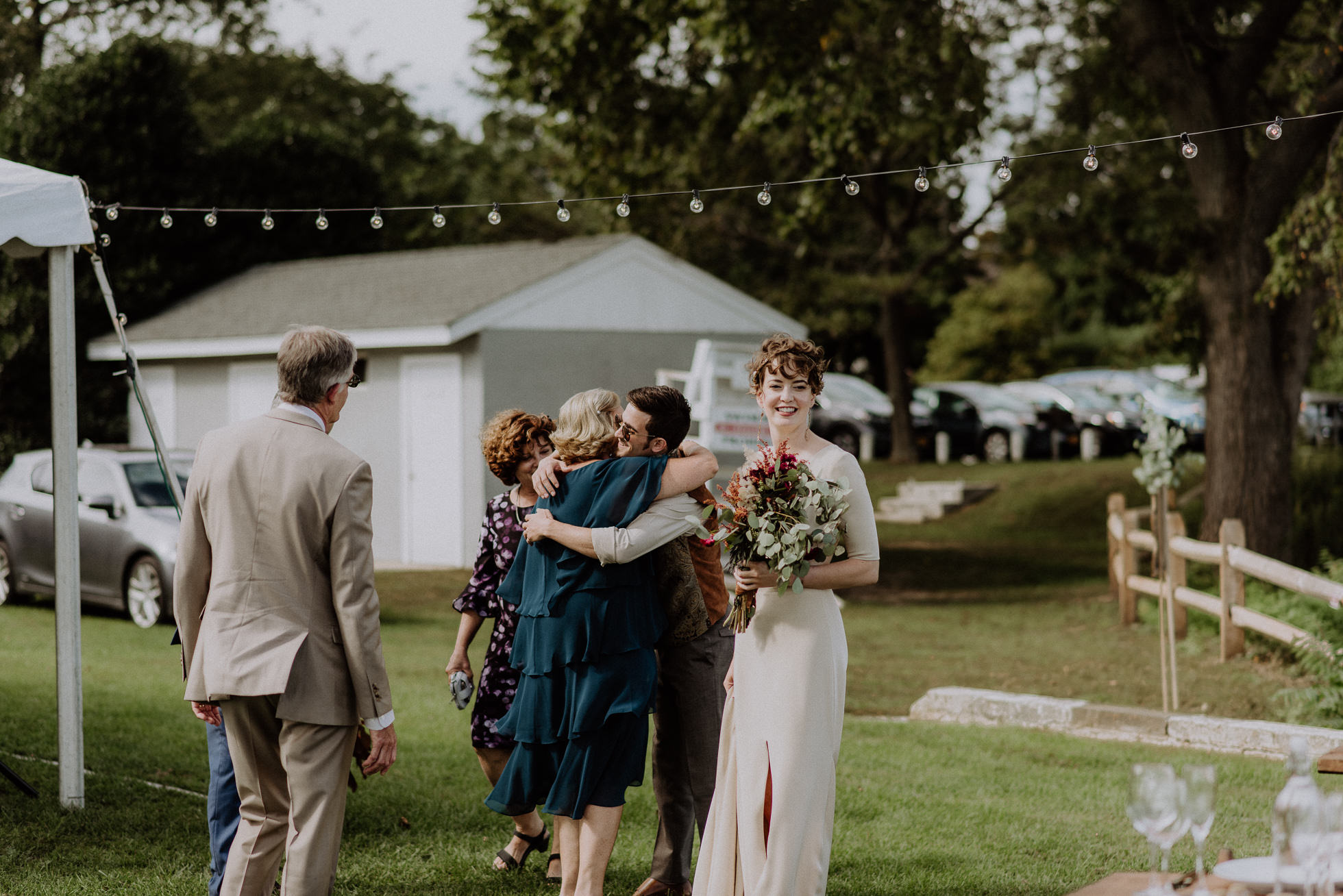 wedding guests greeting bride and groom