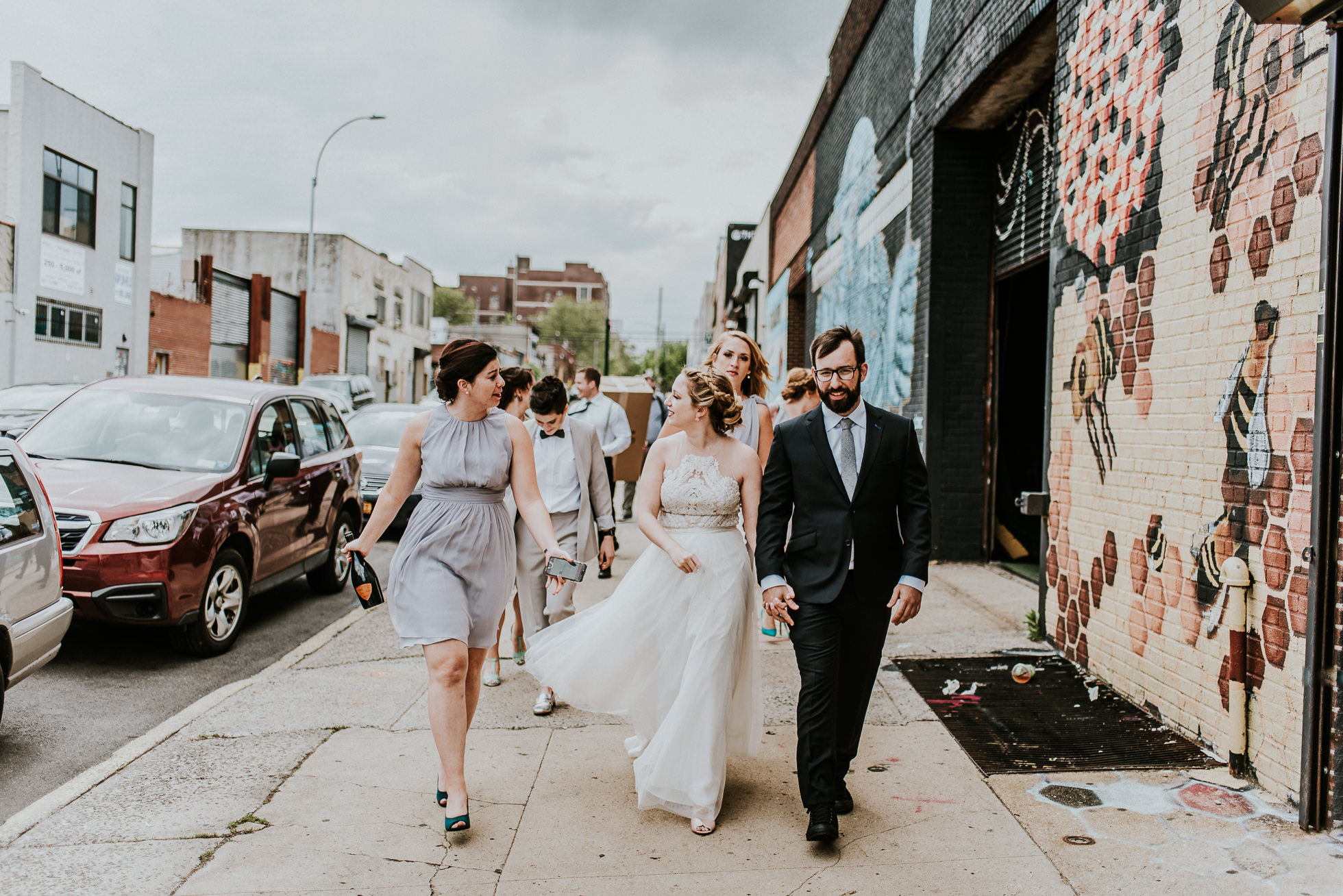 wedding party walking down street photographed by Traverse The Tides