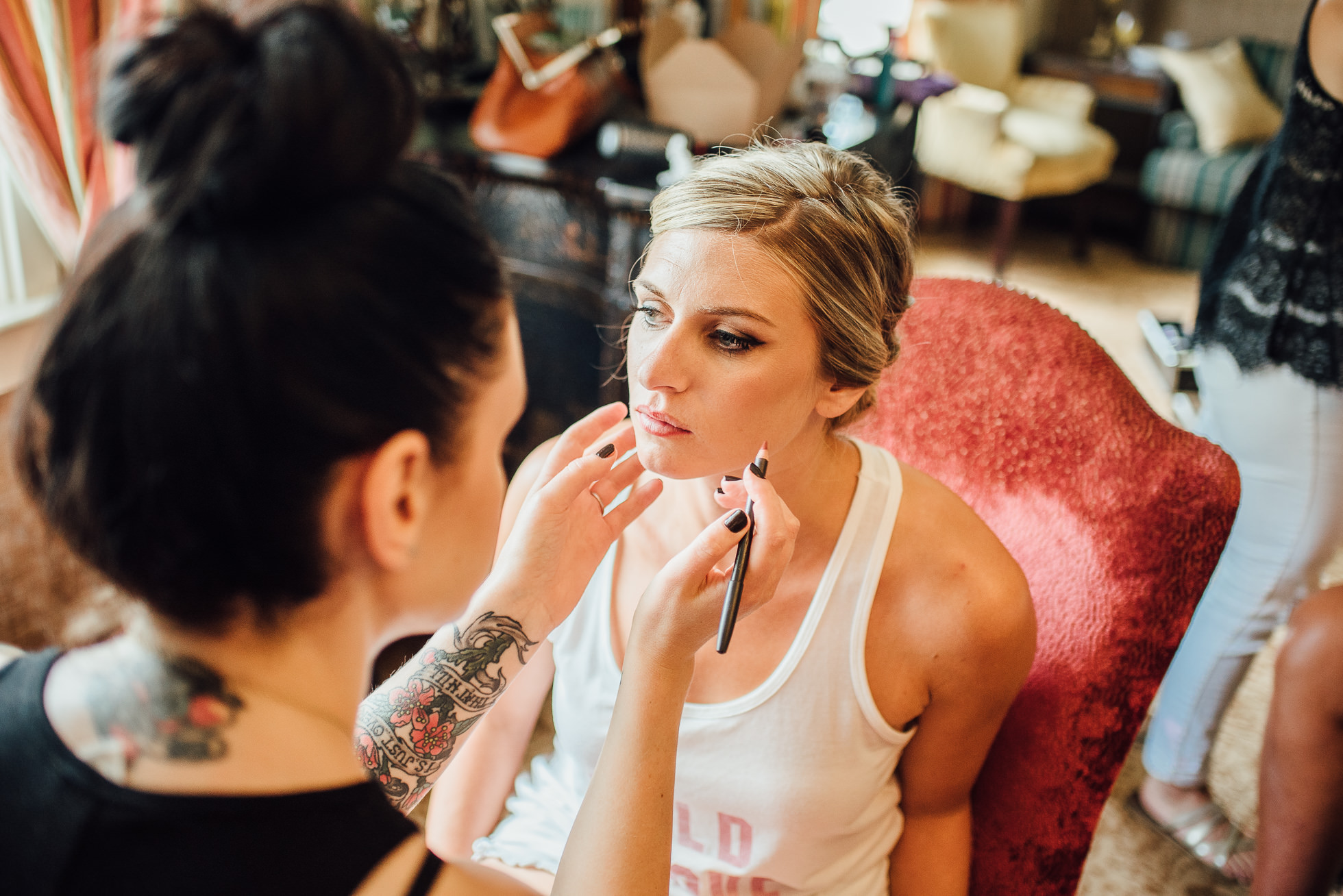 bride getting makeup done at lyndhurst castle wedding photographed by traverse the tides