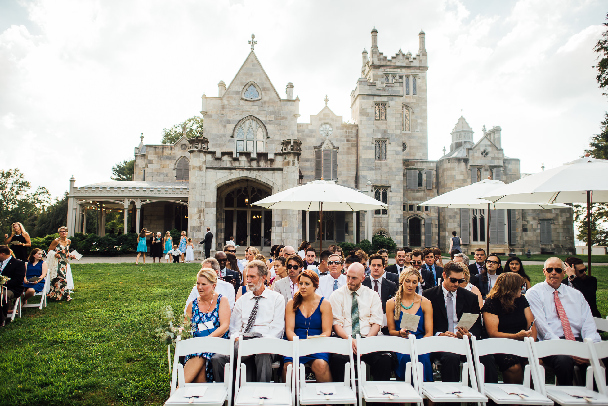 wedding ceremony on lawn at lyndhurst castle photographed by traverse the tides