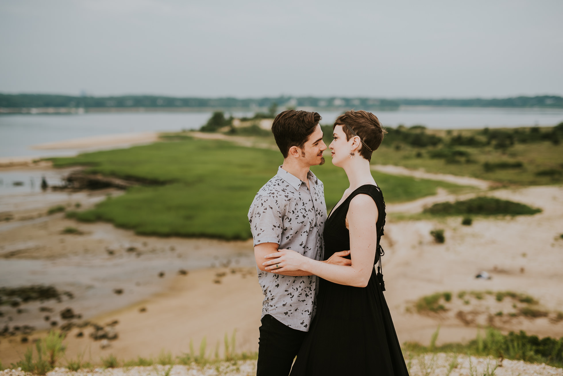 couple kissing engagement photographed by traverse the tides