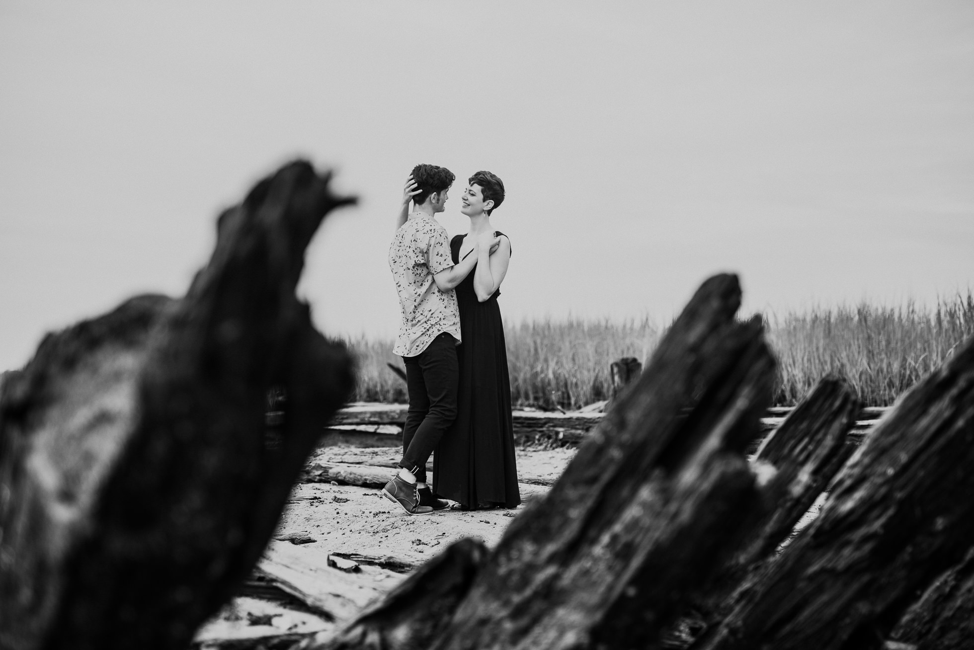 fishing dock engagement photographed by traverse the tides