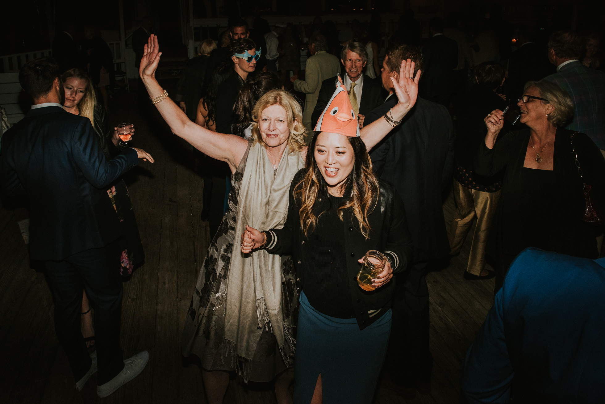 funny hats at wedding reception Montauk wedding photographed by Traverse the Tides