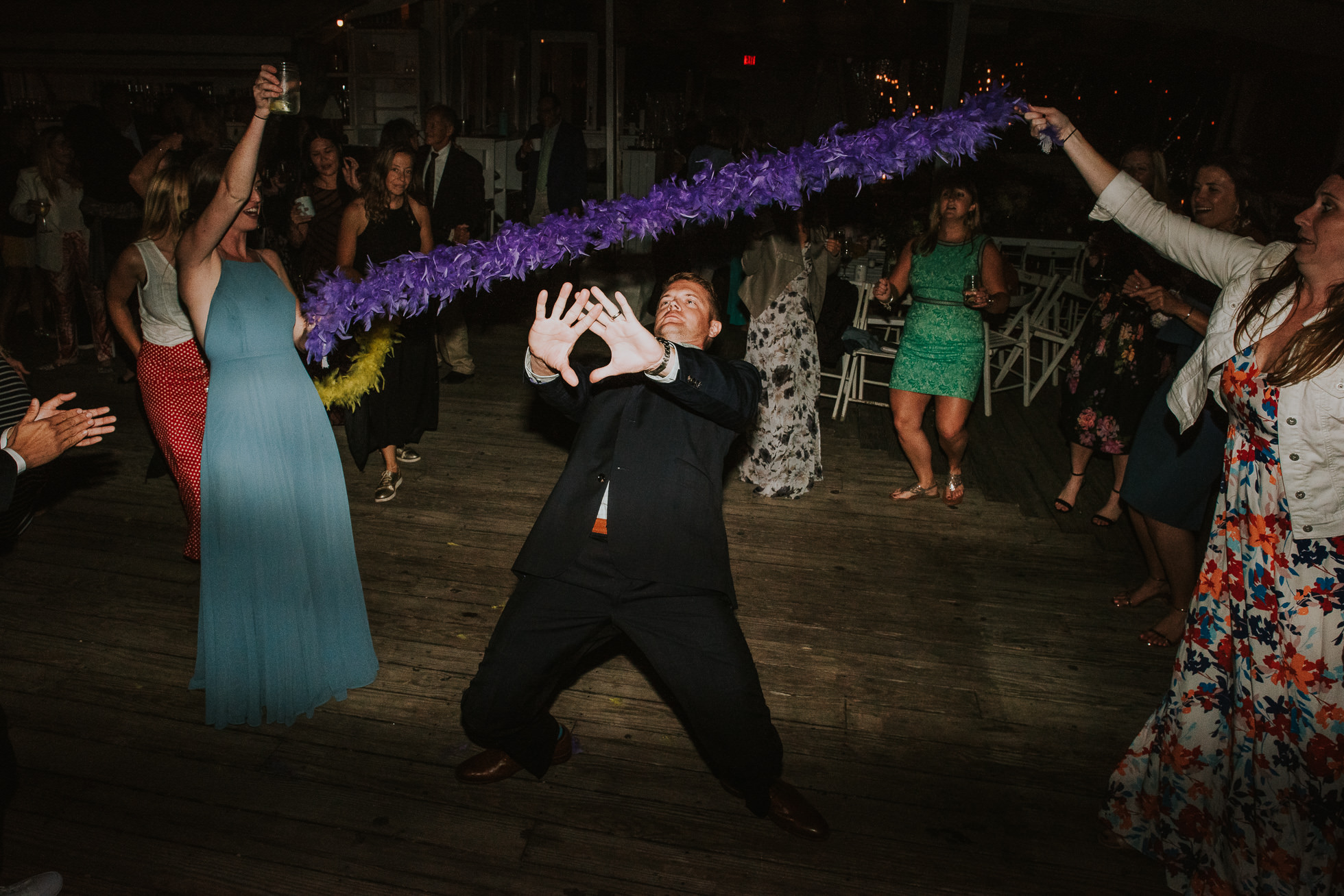 doing the limbo at reception Montauk wedding photographed by Traverse the Tides