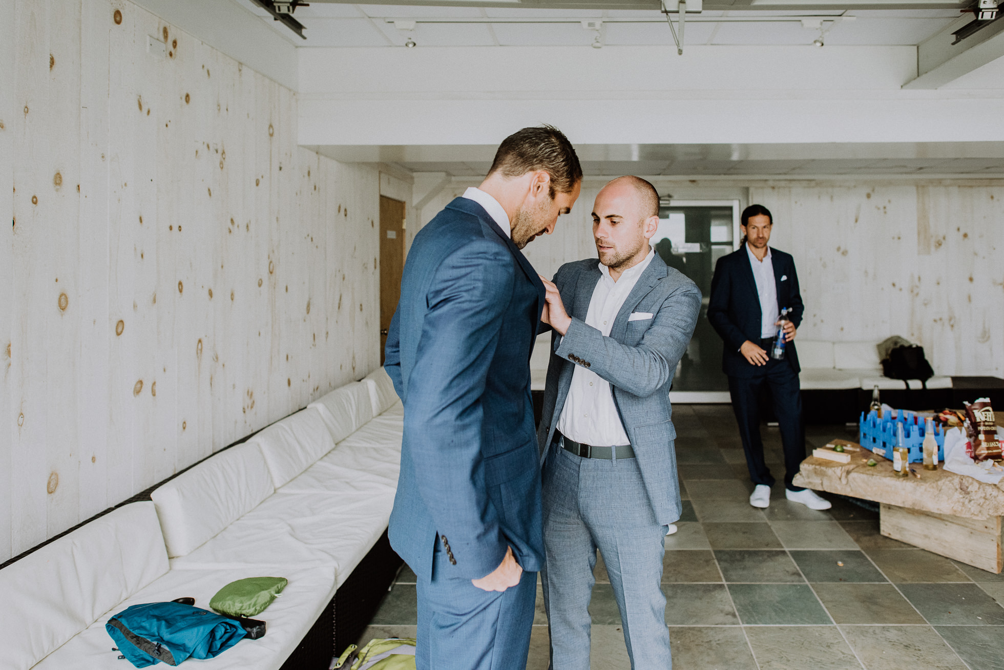 groomsmen getting dressed Montauk photographed by Traverse the Tides