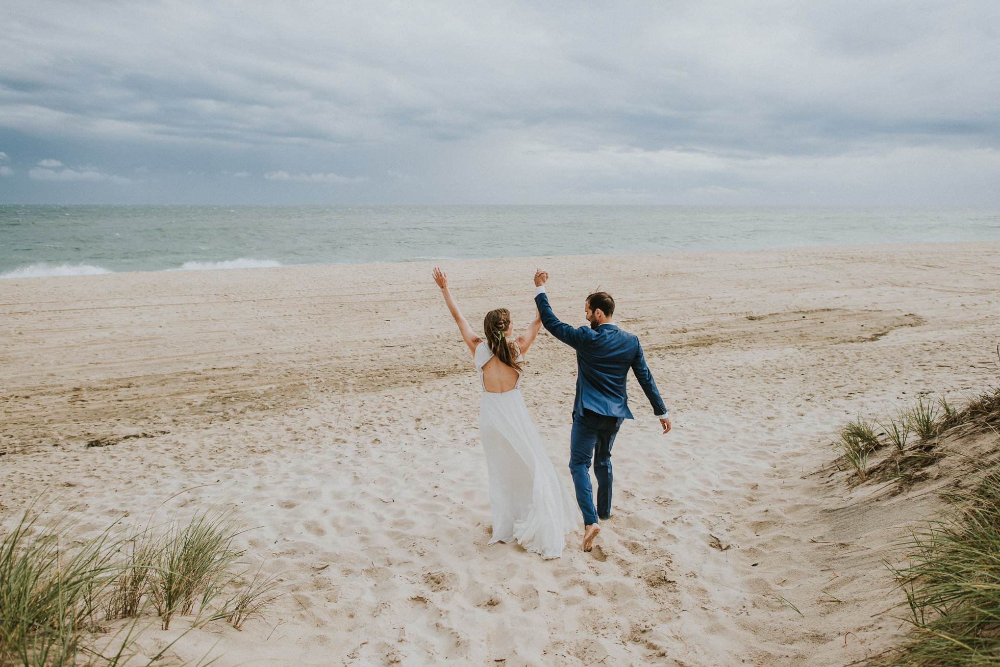 surfer bride and groom at the beach Montauk wedding photographed by Traverse the Tides