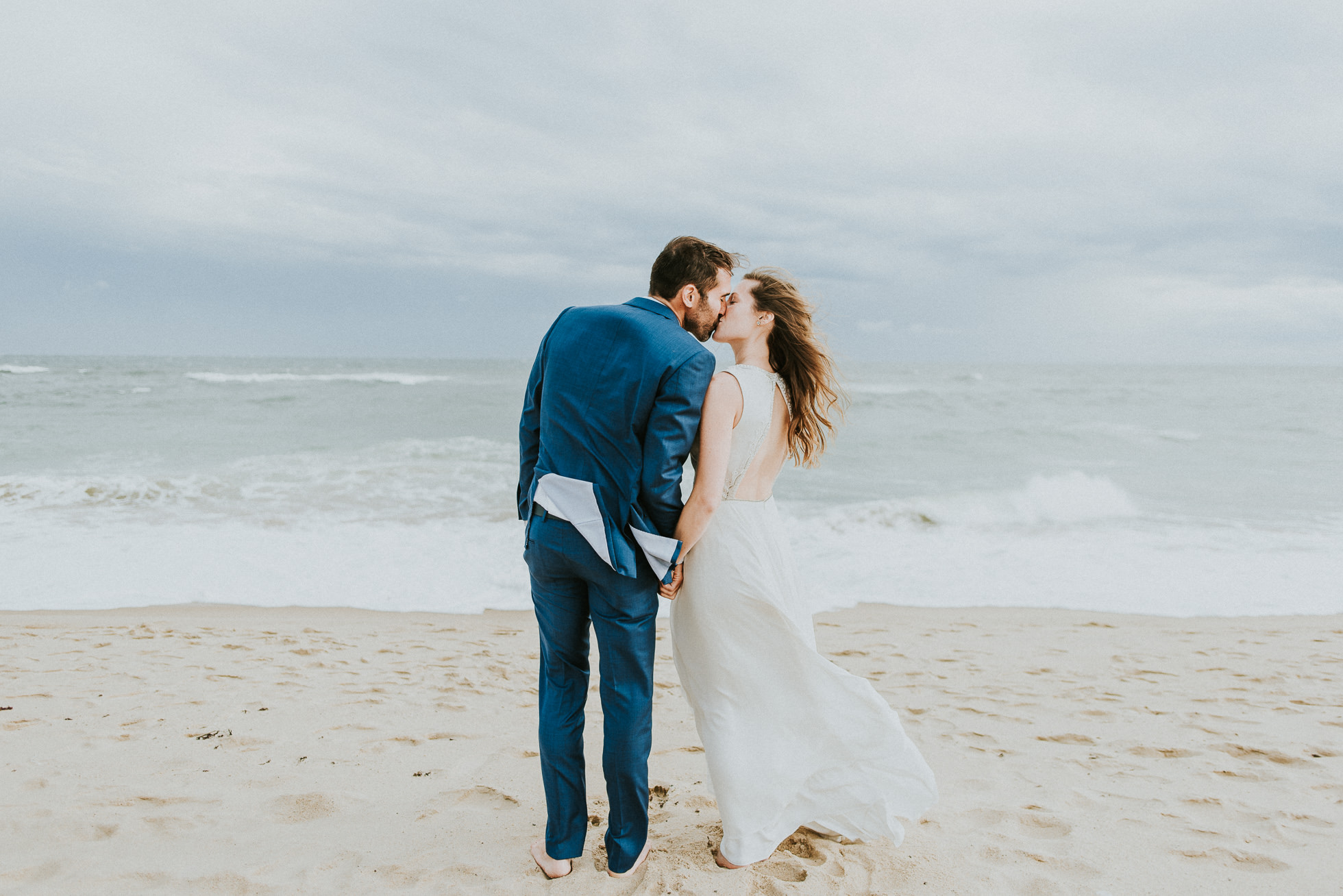 bride and groom toes in the sand Montauk wedding photographed by Traverse the Tides