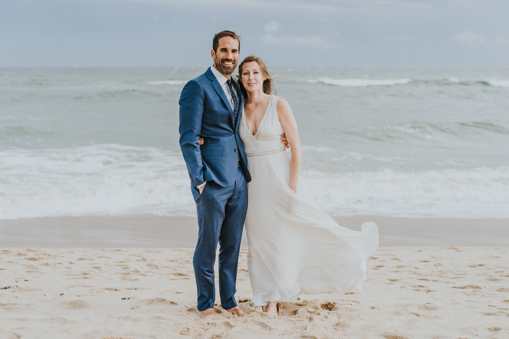 smiling bride and groom at beach Montauk wedding photographed by Traverse the Tides