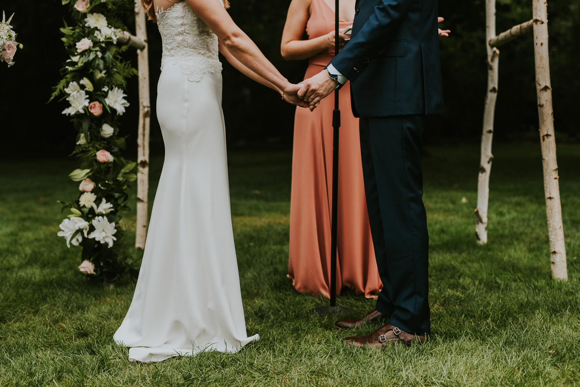 bride and groom holding hands Long Island wedding ceremony