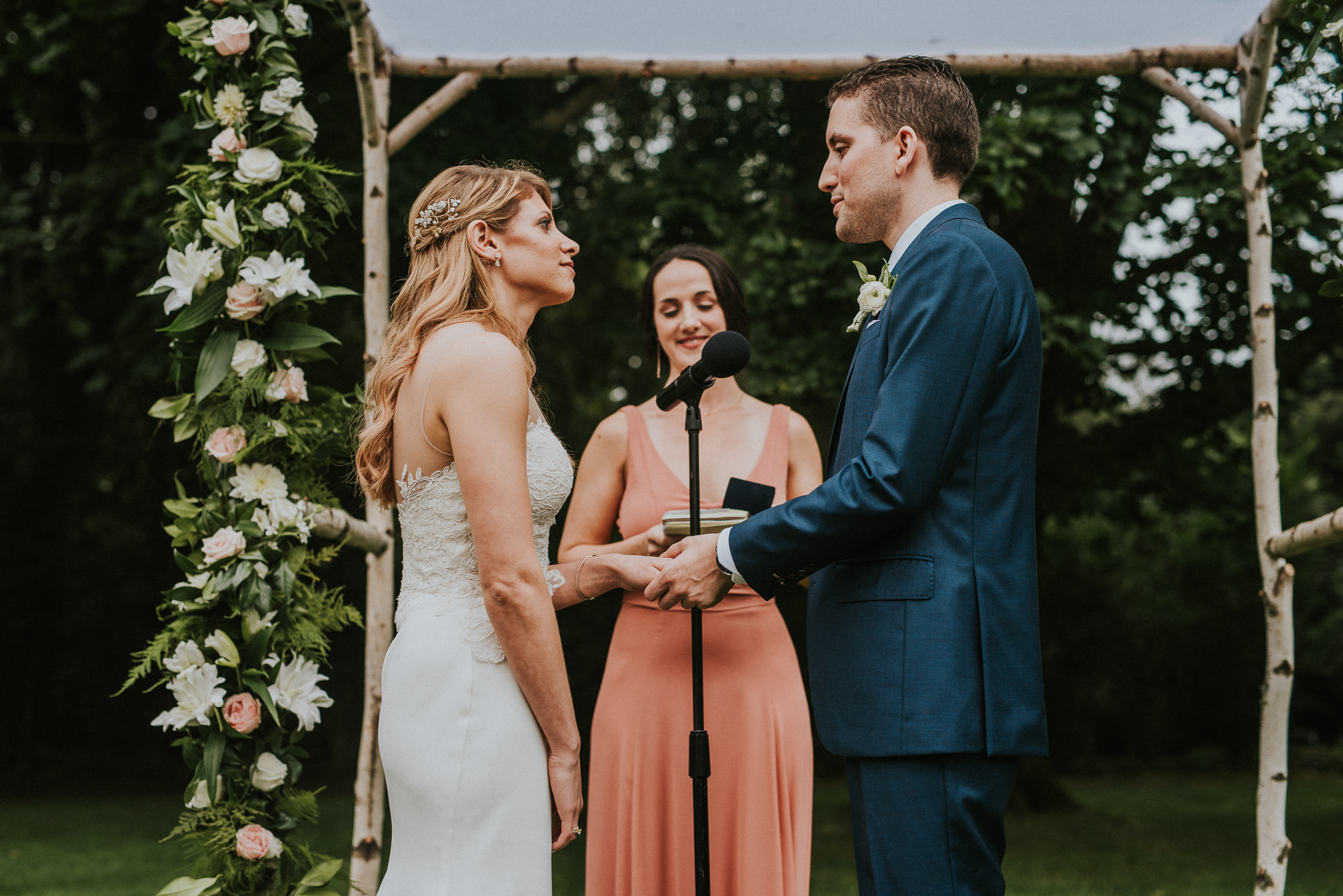 bride and groom exchanging rings long island wedding