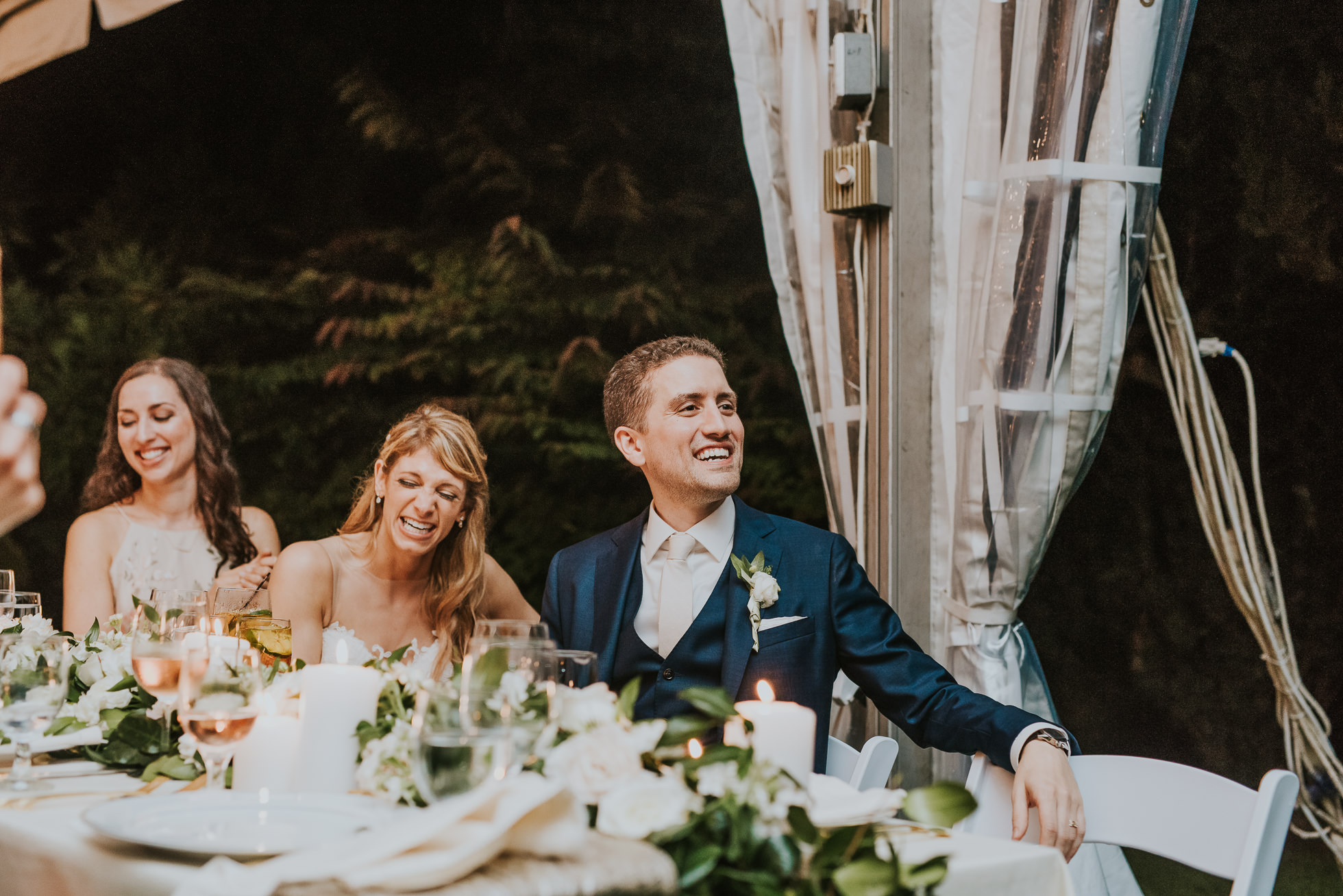 bride and groom laughing the Hedges Inn reception