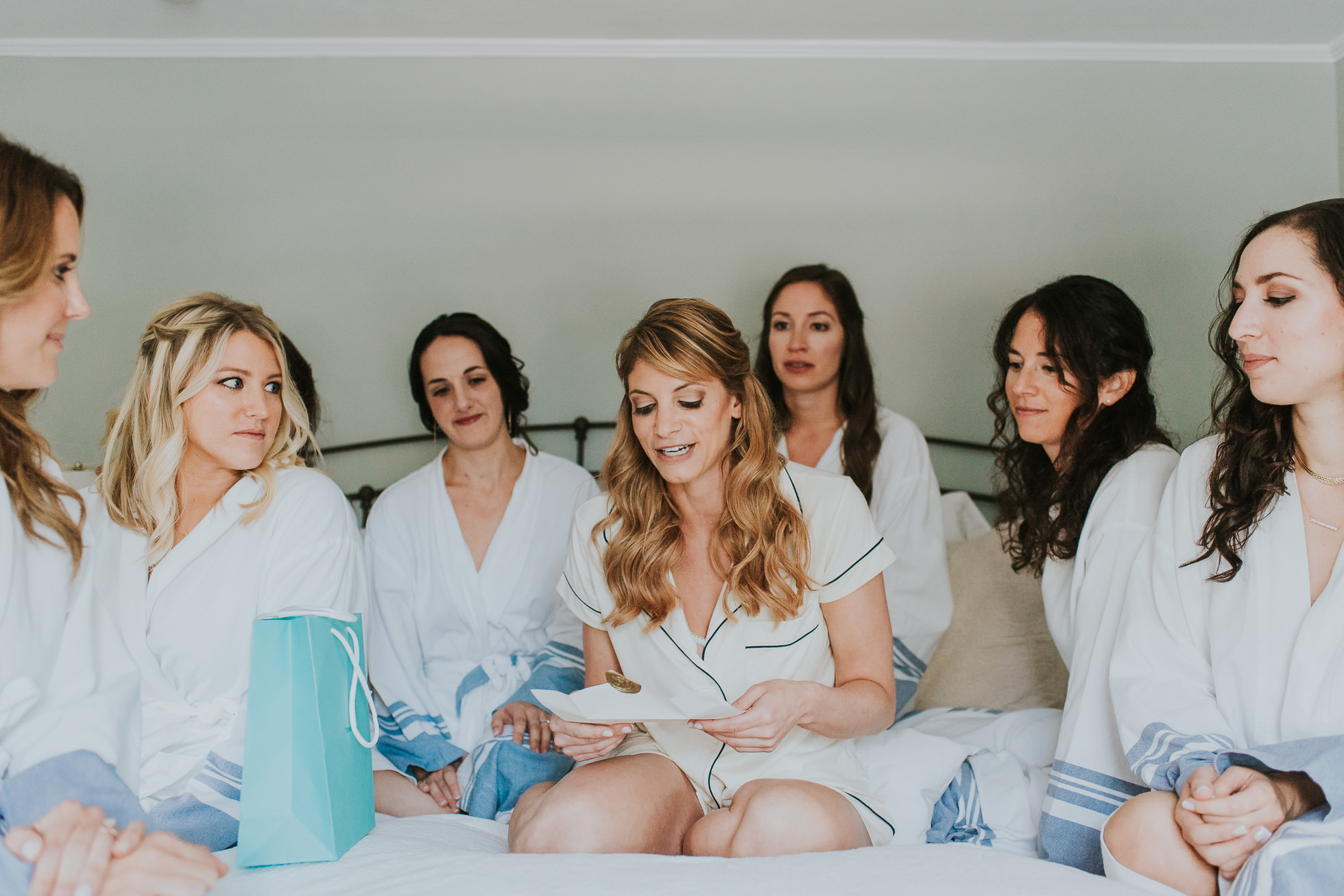 bride opening gift at wedding