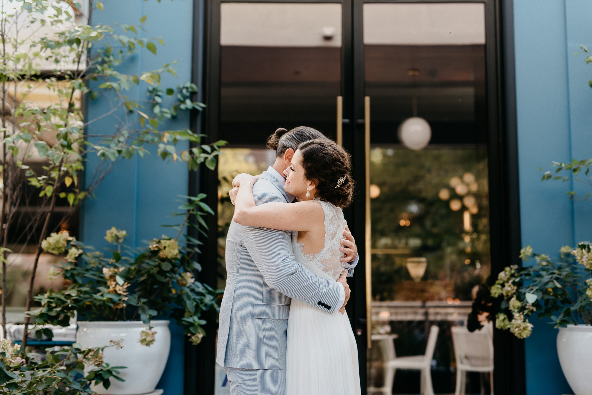 bride and groom hugging first look